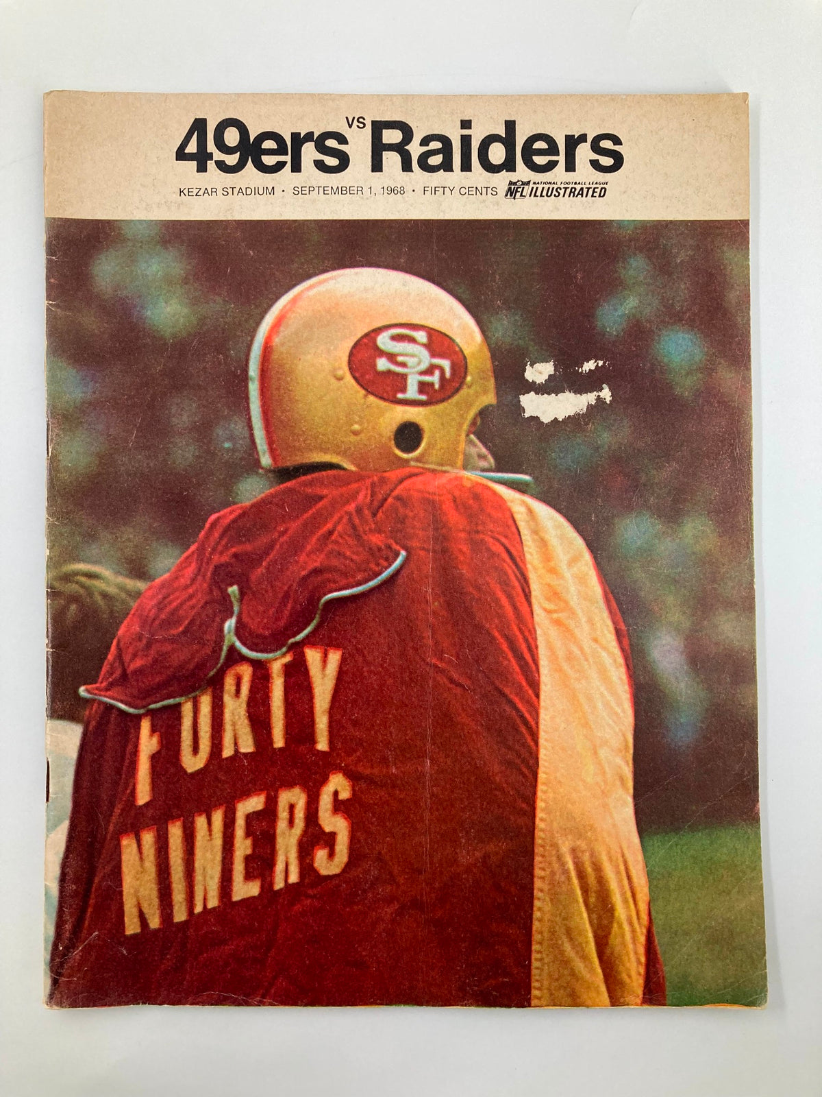 1968 NFL Illustrated Las Vegas Raiders vs San Francisco 49ers Official Program cover featuring a player with a red jacket marked 'FORTY NINERS', taken at Kezar Stadium on September 1, 1968.