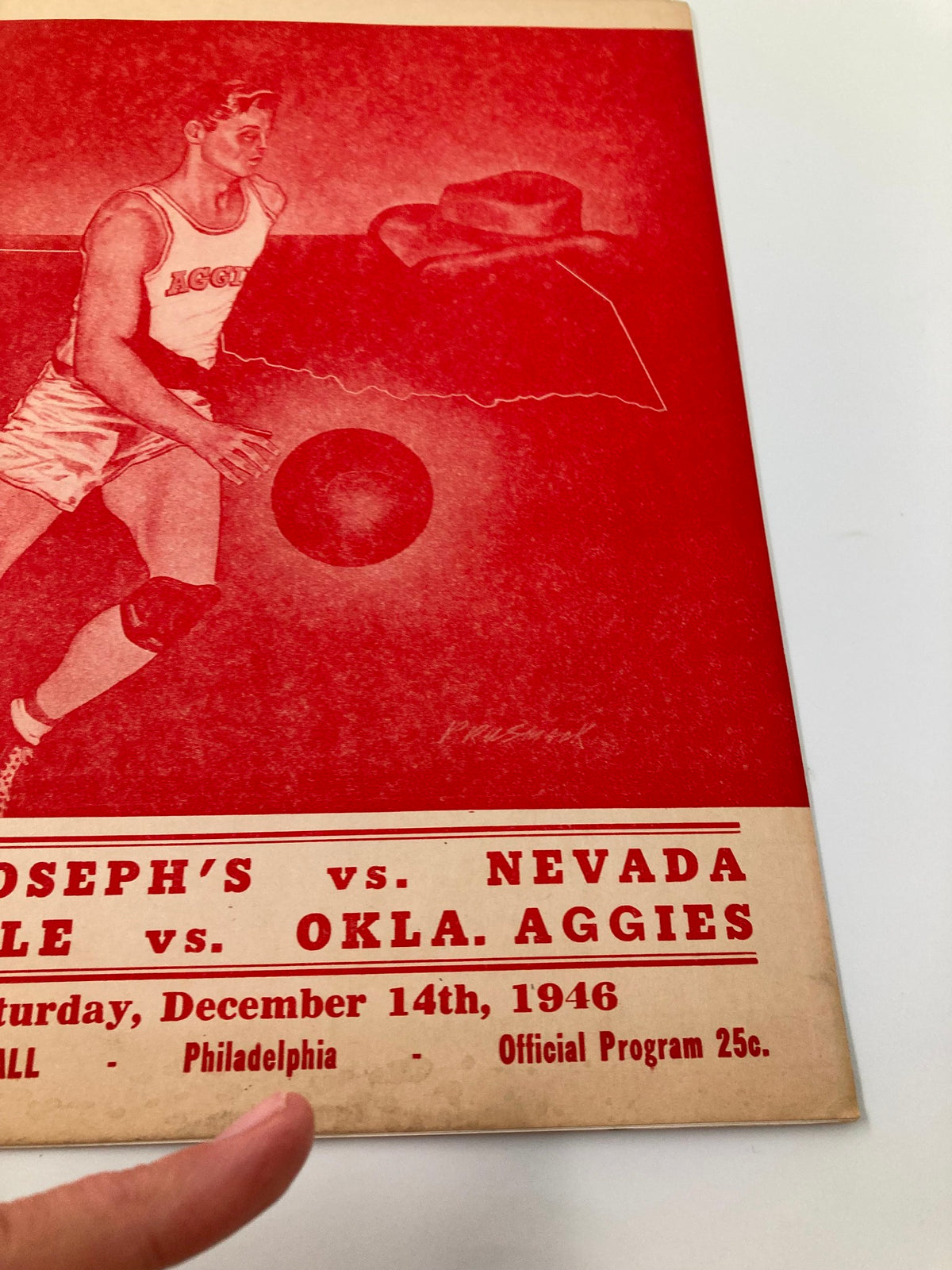 1946 NCAA Basketball St. Joseph's Hawks vs Nevada Wolf Pack Official Program with focus on the player illustration and game details, showcasing the vintage design and collectible value.
