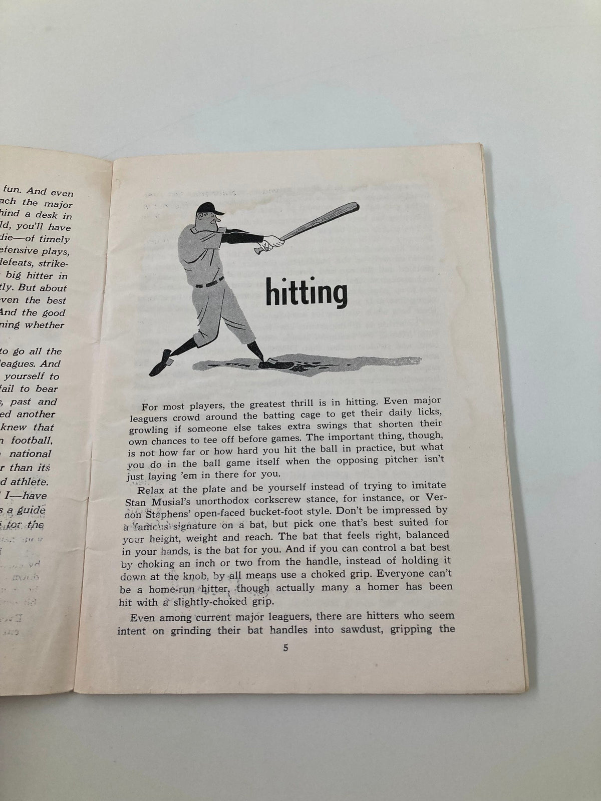 Interior page of 'Stan Musial's How The Majors Play Baseball' by Bob Broeg focused on the section about hitting, including illustrations and text.