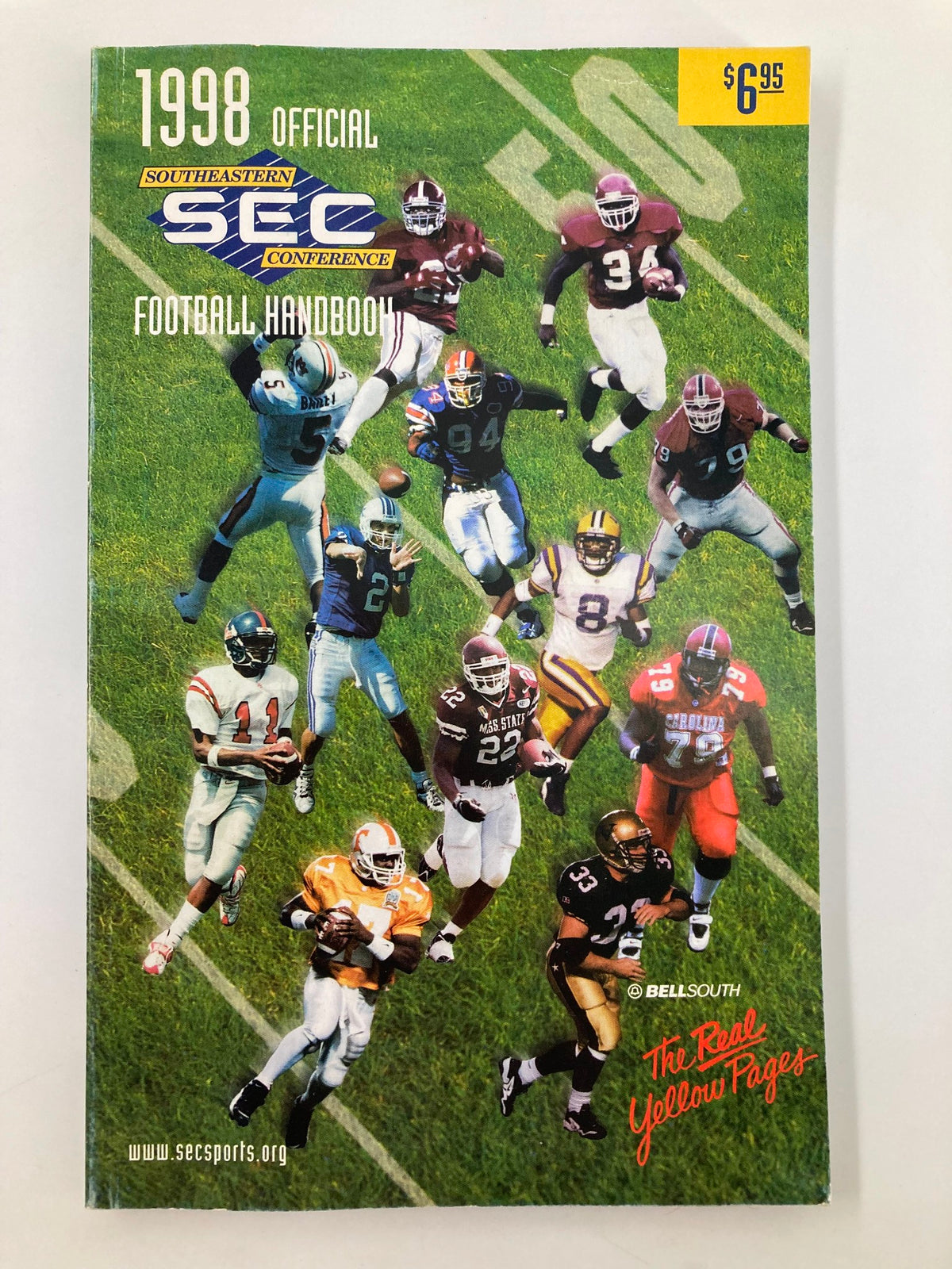 1998 Official Southeastern Conference Football Handbook cover featuring action shots of football players on the field.