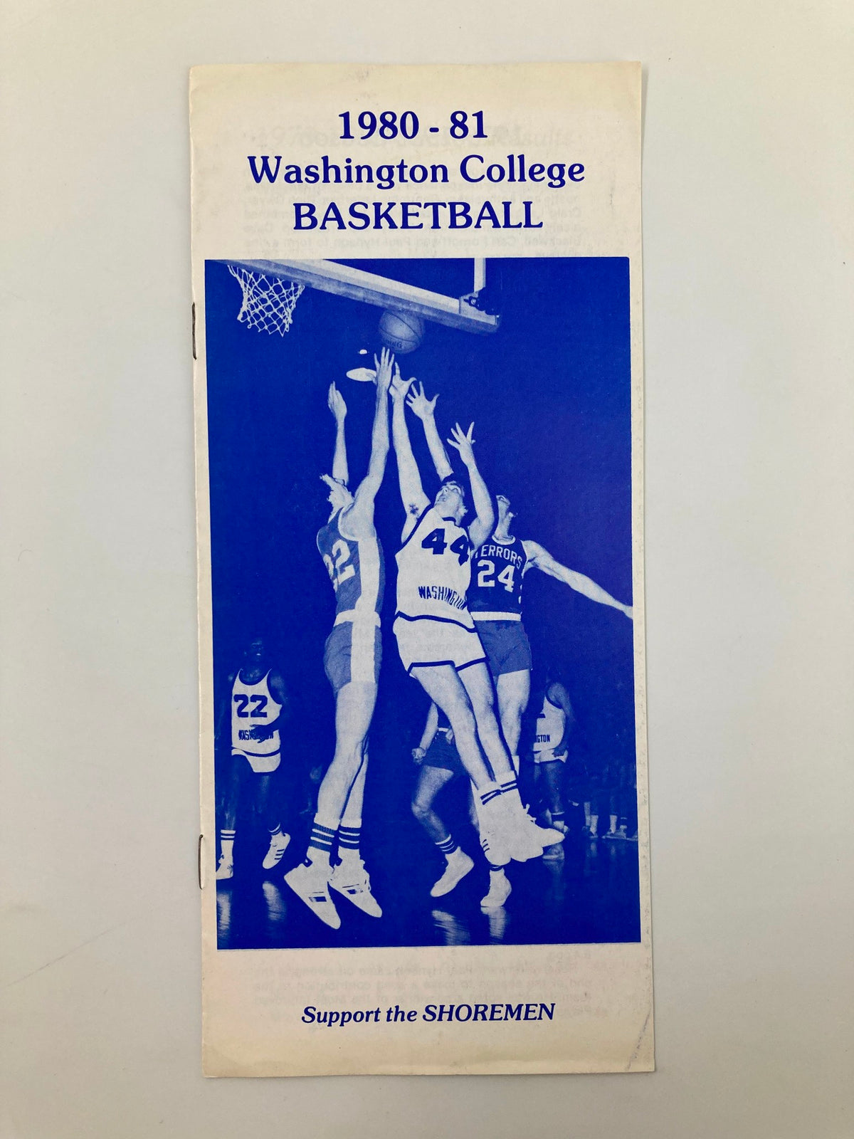 1980-81 Washington College Basketball Program cover featuring players in action during a game, emphasizing the vibrant college basketball culture of the early 1980s.