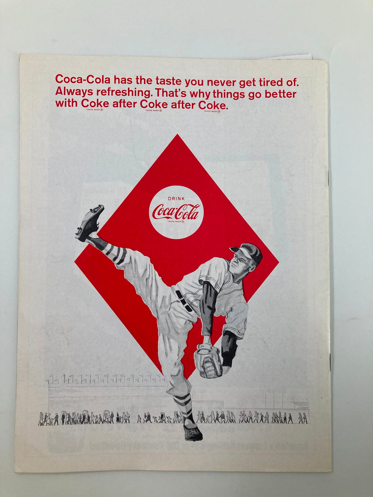 1996 Baseball The Senators American League Official Scoreboard Program - Advertisement page showcasing Coca-Cola with a baseball player illustration.