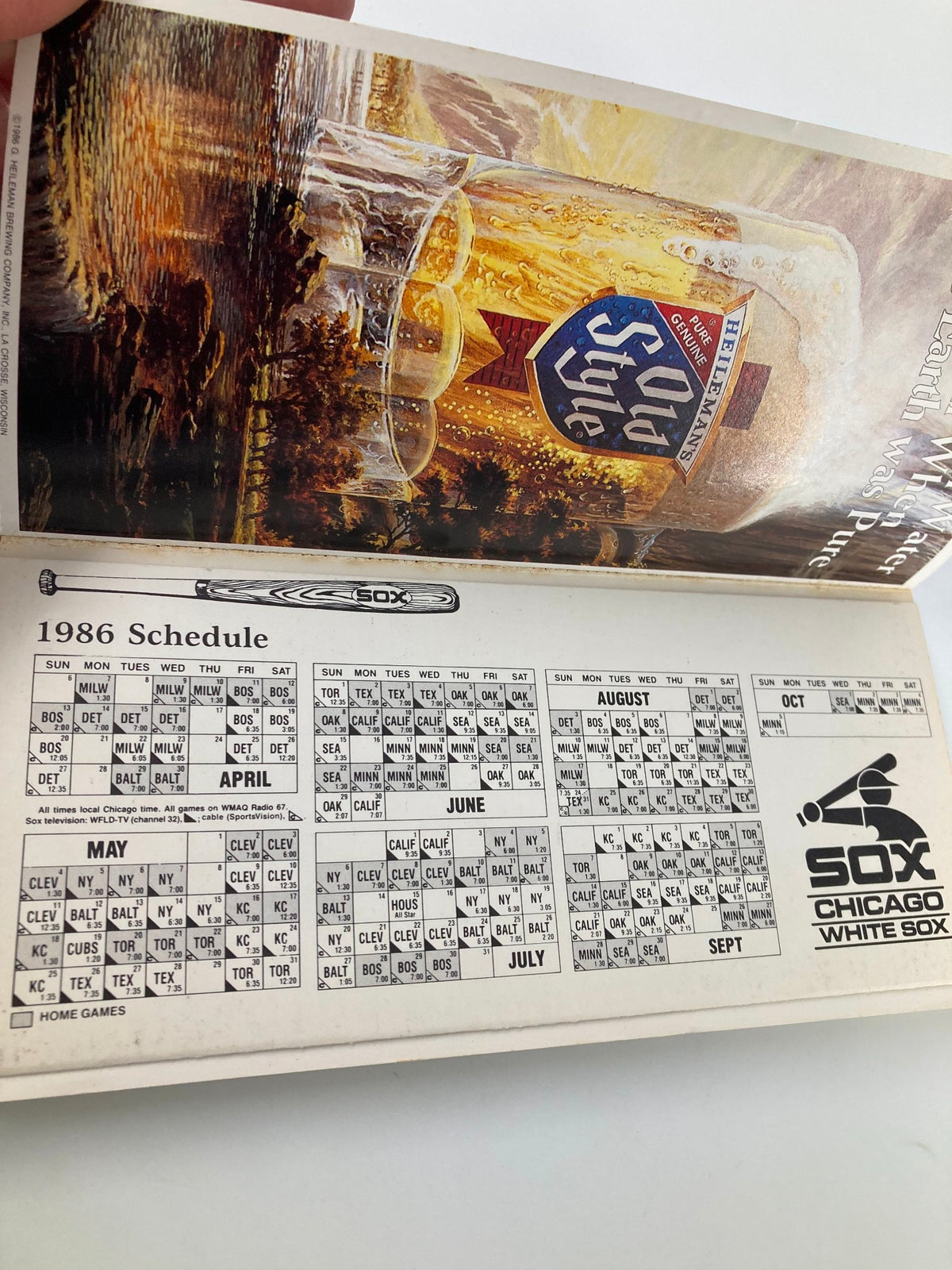 1986 MLB Chicago White Sox Media Guide Aces In The Hole displaying the team's schedule with a vintage illustration of a beer glass, emphasizing the baseball season details.