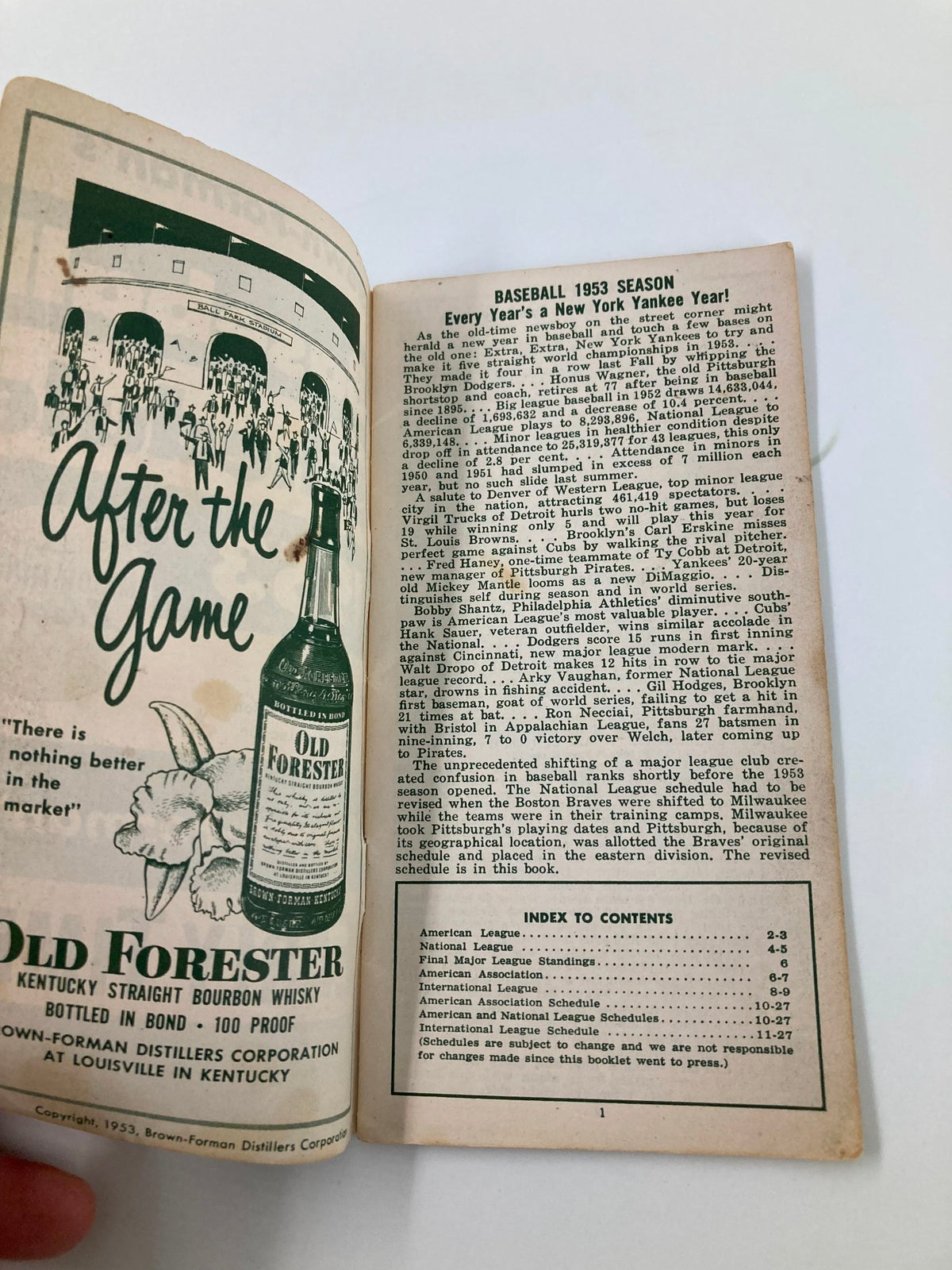 1953 Major-Minor Leagues Brown-Forman's Baseball Schedule featuring an inside view of the booklet with content about the baseball season, including the New York Yankees, game attendance statistics, and advertisements.