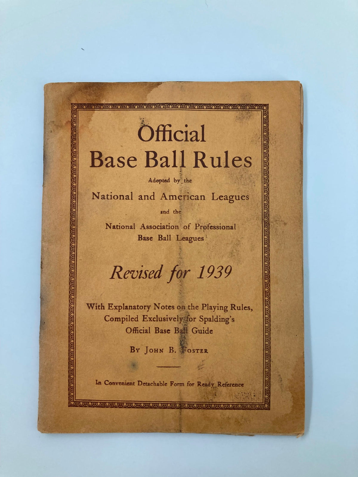 Cover of the vintage magazine '1939 Official Base Ball Rules National and American Leagues', featuring the title and details about its publication. The cover is well-worn, reflecting its age, with a vintage design and explanatory notes regarding the playing rules.