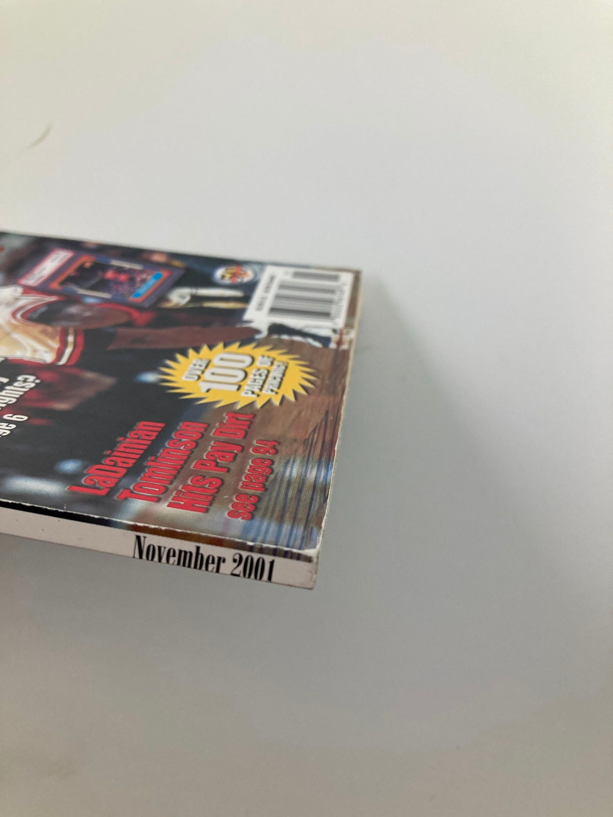 Profile view of the magazine for Graded Card Price Guide November 2001 NBA Chicago Bulls Michael Jordan, highlighting its edge and spine design.