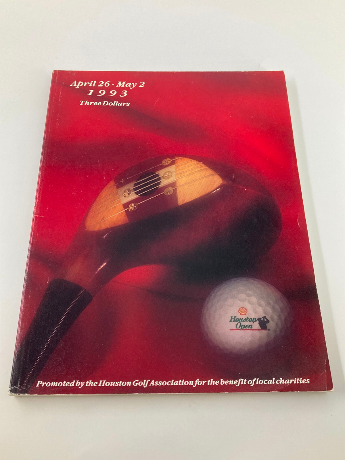 Alternative view of the cover of the April 26 1993 Shell Houston Golf Association Open Program showcasing a golf driver and a golf ball.