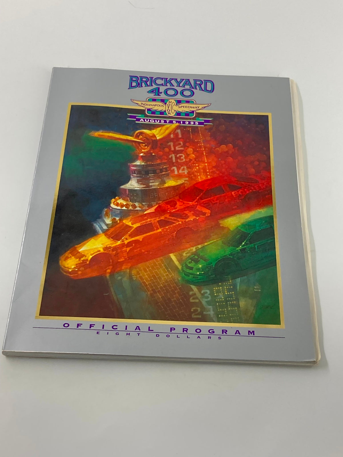 August 5 1995 Brickyard 400 Indianapolis Motor Speedway Official Program cover showcasing artistic design and racing cars.