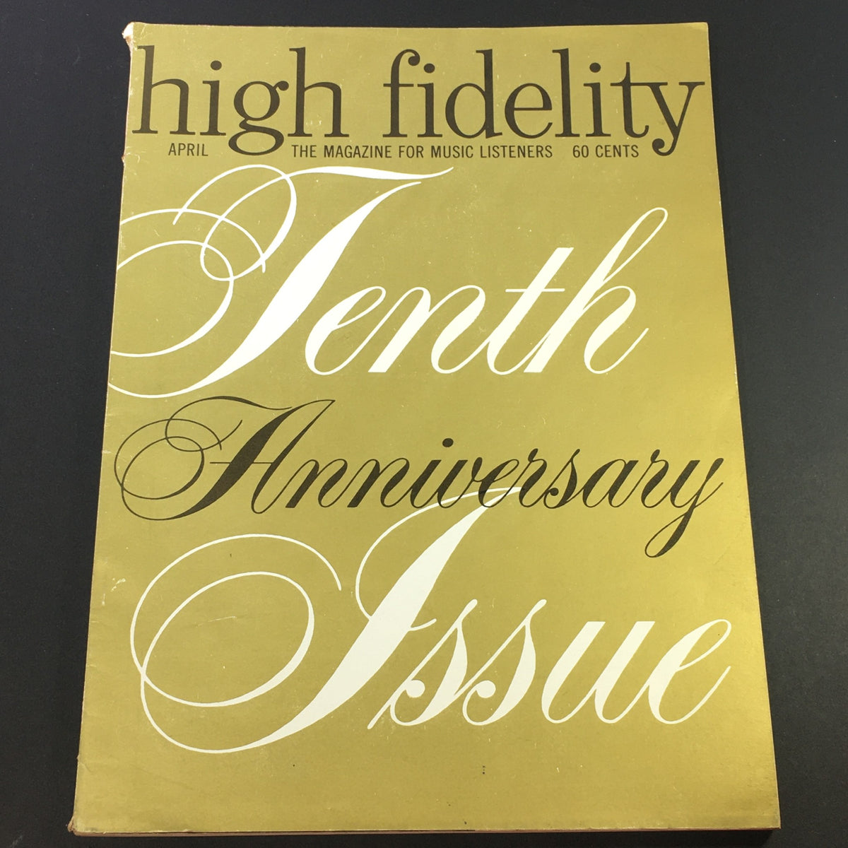 Cover of the VTG High Fidelity Music Magazine April 1961 - Tenth Anniversary Special featuring elegant typography and a minimalist design. This vintage magazine highlights the significant milestone of ten years in music history, offering insights into the culture of the early 1960s.