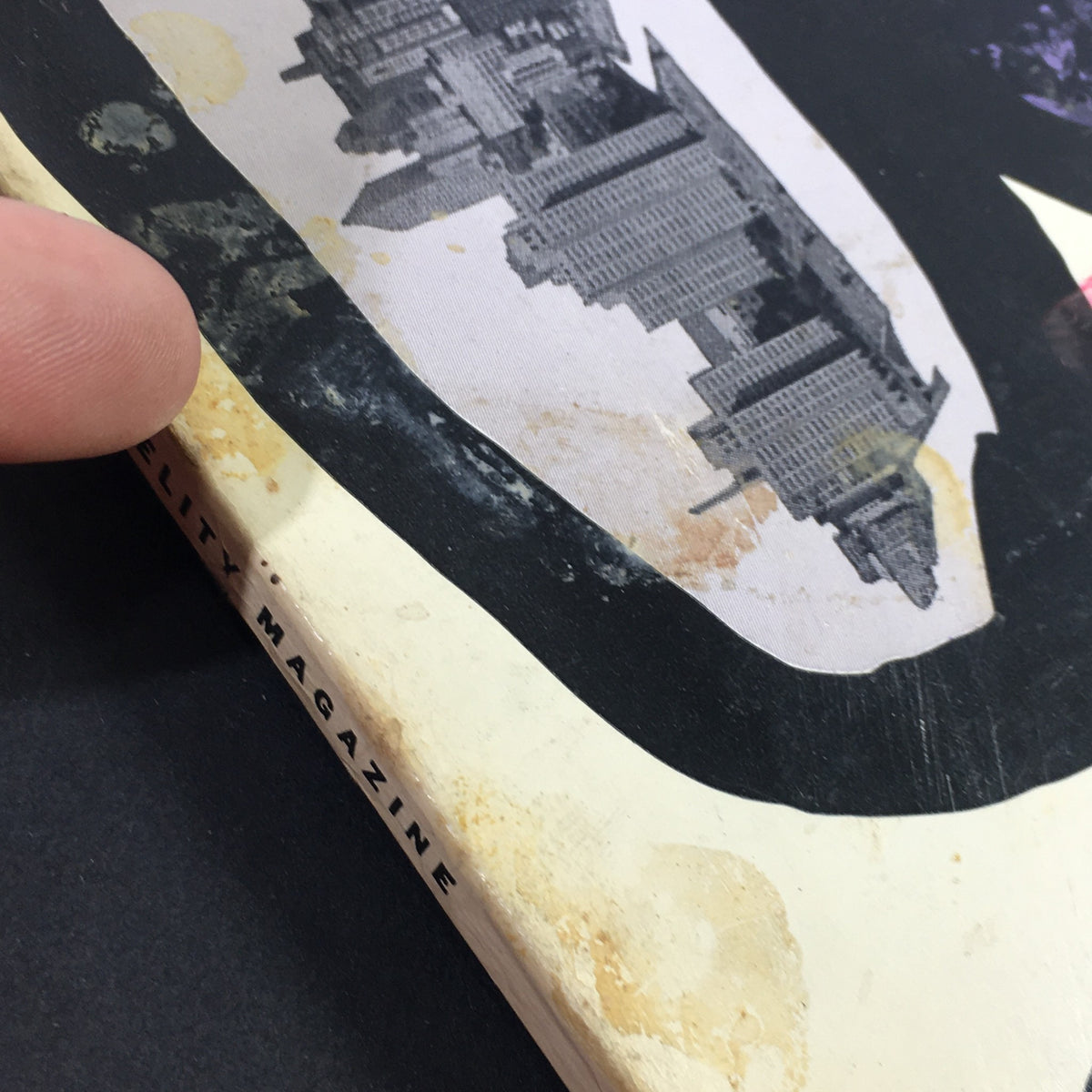 Close-up view of the VTG High Fidelity Music Magazine February 1957 spine and edge, illustrating age marks and wear.