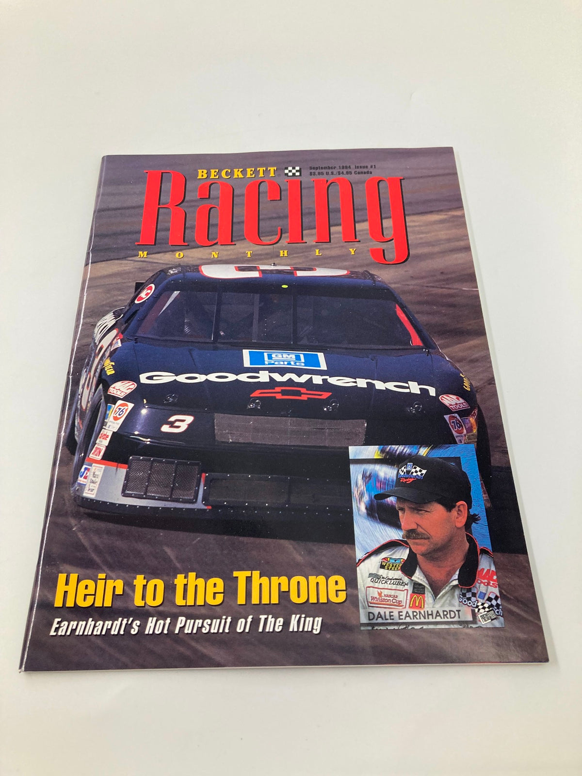 Beckett Racing Monthly September 1994 cover featuring Dale Earnhardt and a racing car, highlighting the issue's theme 'Heir to the Throne'.