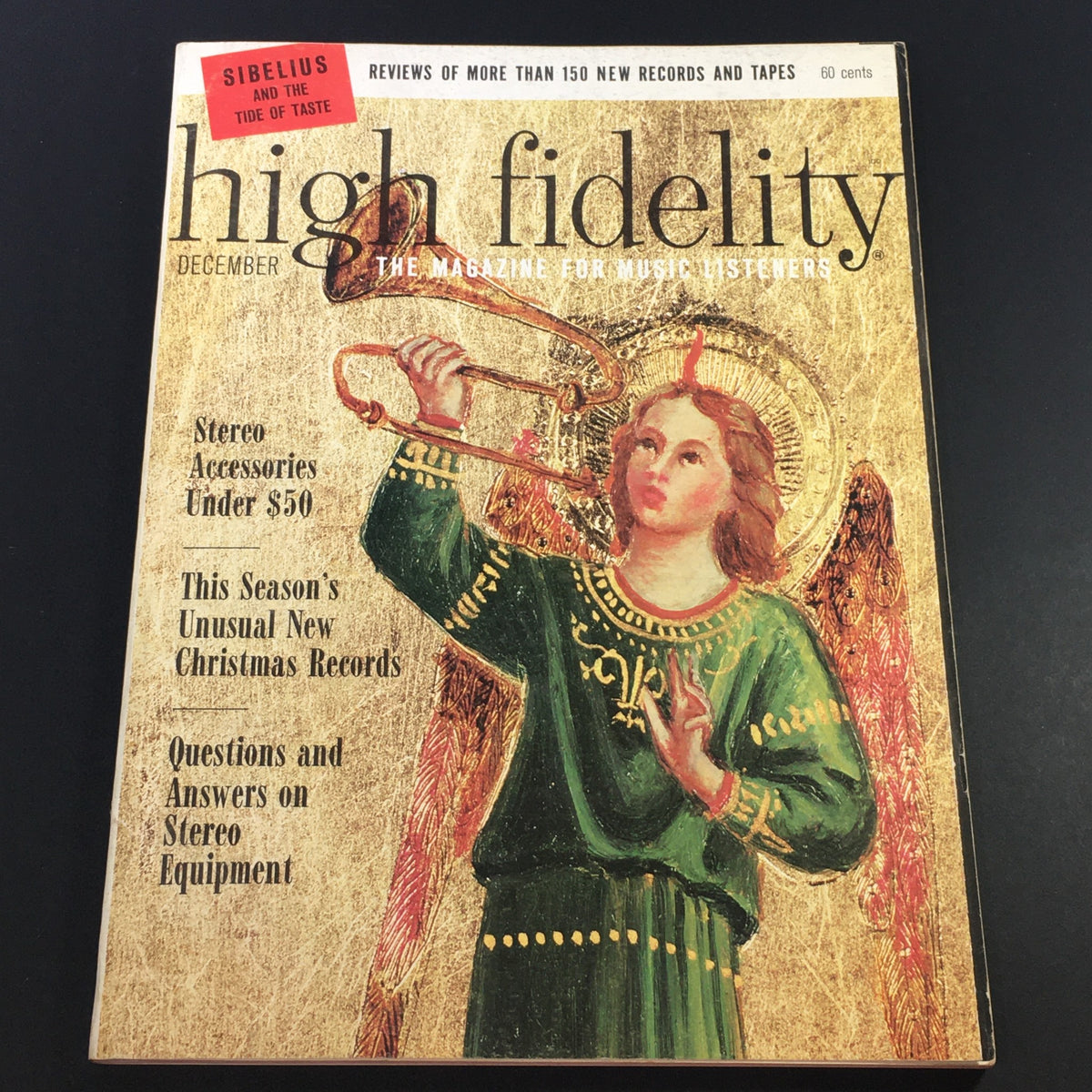 Cover of VTG High Fidelity Music Magazine December 1965 featuring an angel playing a trombone, highlighting Sibelius and The Taste of It, and showcasing articles on stereo accessories and Christmas records.