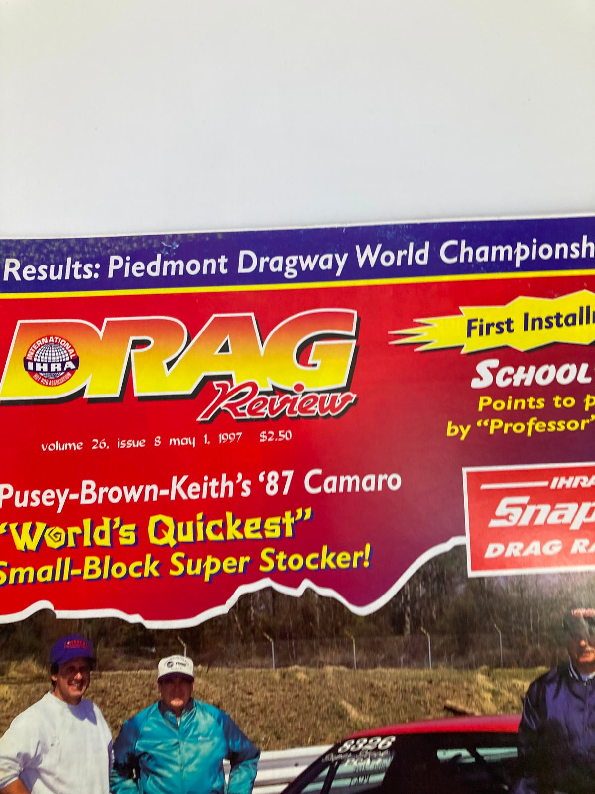 Zoomed view of the IHRA Drag Review Magazine May 1, 1997, emphasizing the features of Pusey-Brown-Keith's '87 Camaro, the 'World's Quickest' Small-Block Super Stocker with notable mention of the drivers.