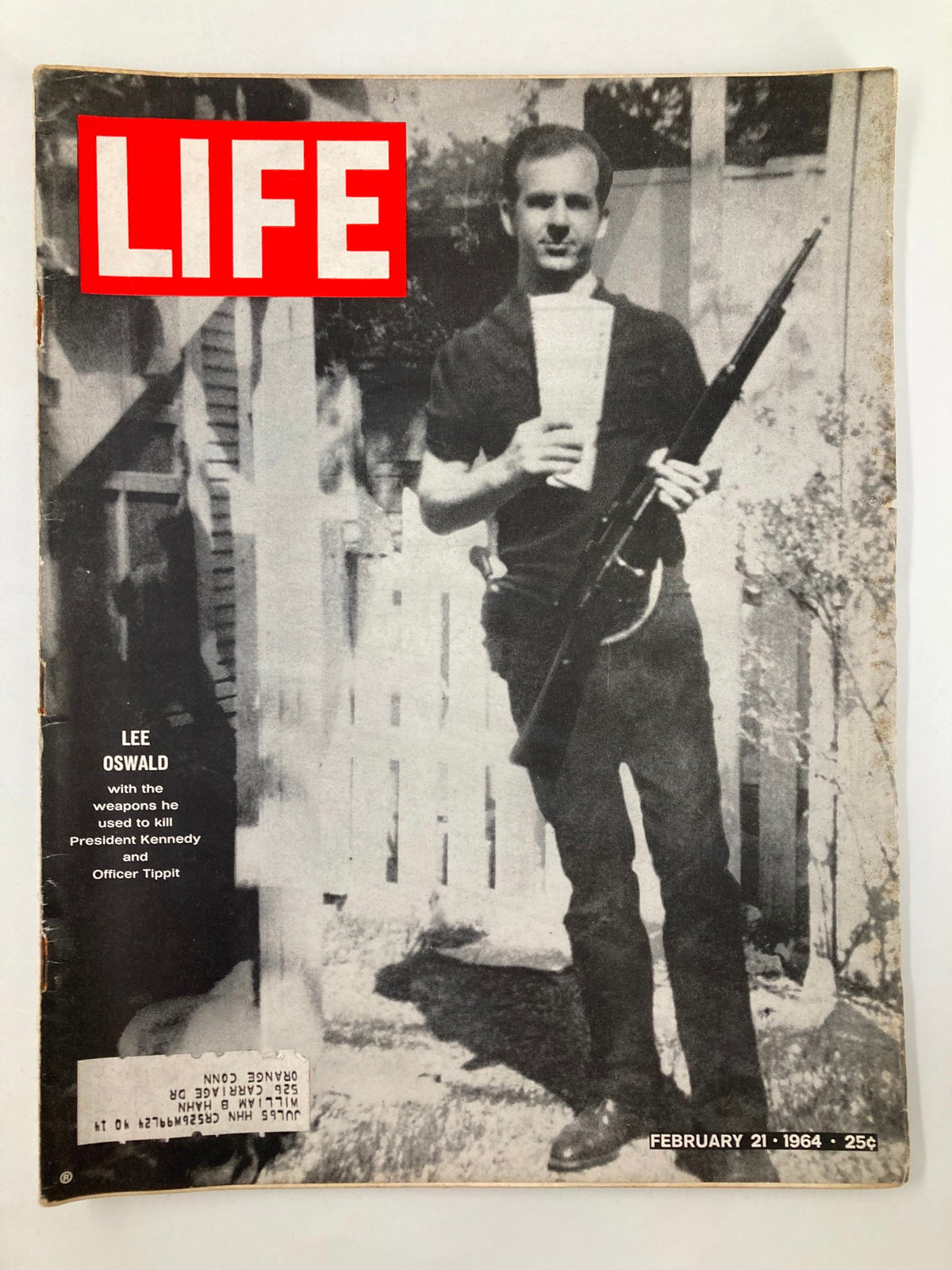VTG Life Magazine February 21, 1964 cover featuring Lee Harvey Oswald holding a firearm, highlighting weapons associated with the assassination of President John F. Kennedy.