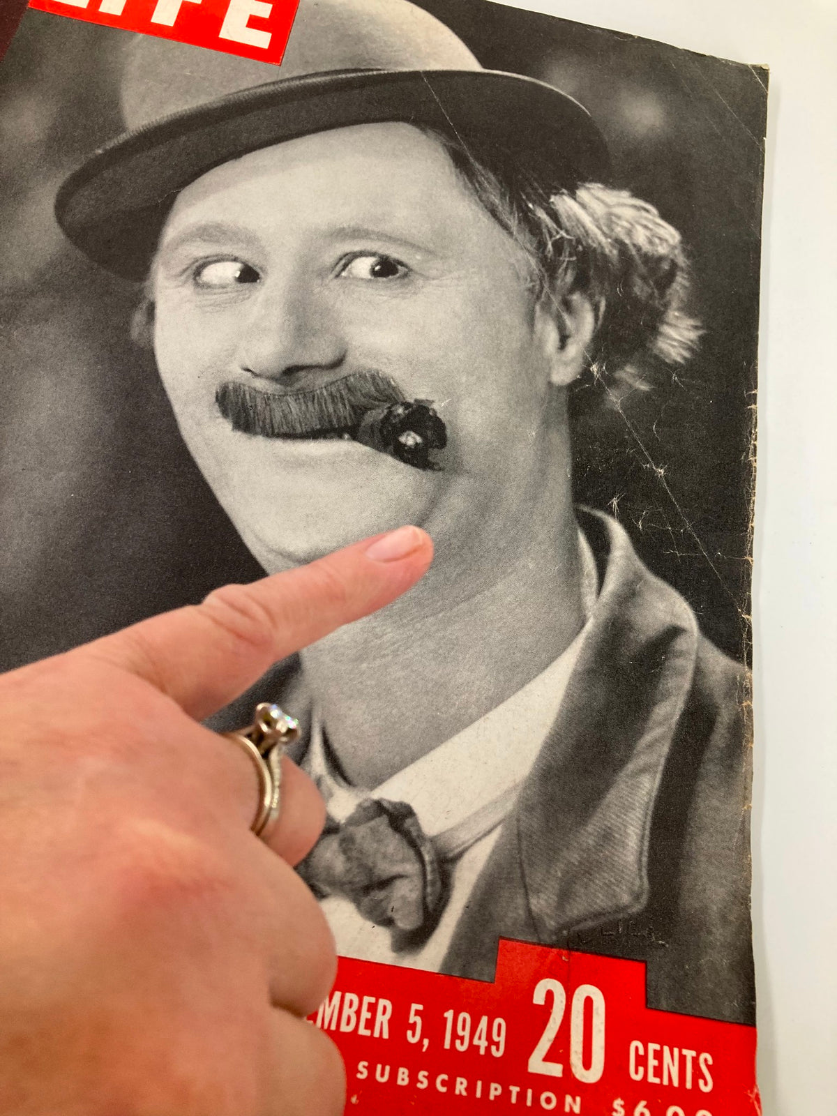 Close-up of VTG Life Magazine September 5 1949 cover highlighting Ben Turpin with a hand pointing at the magazine, illustrating a moment of comedic expression.