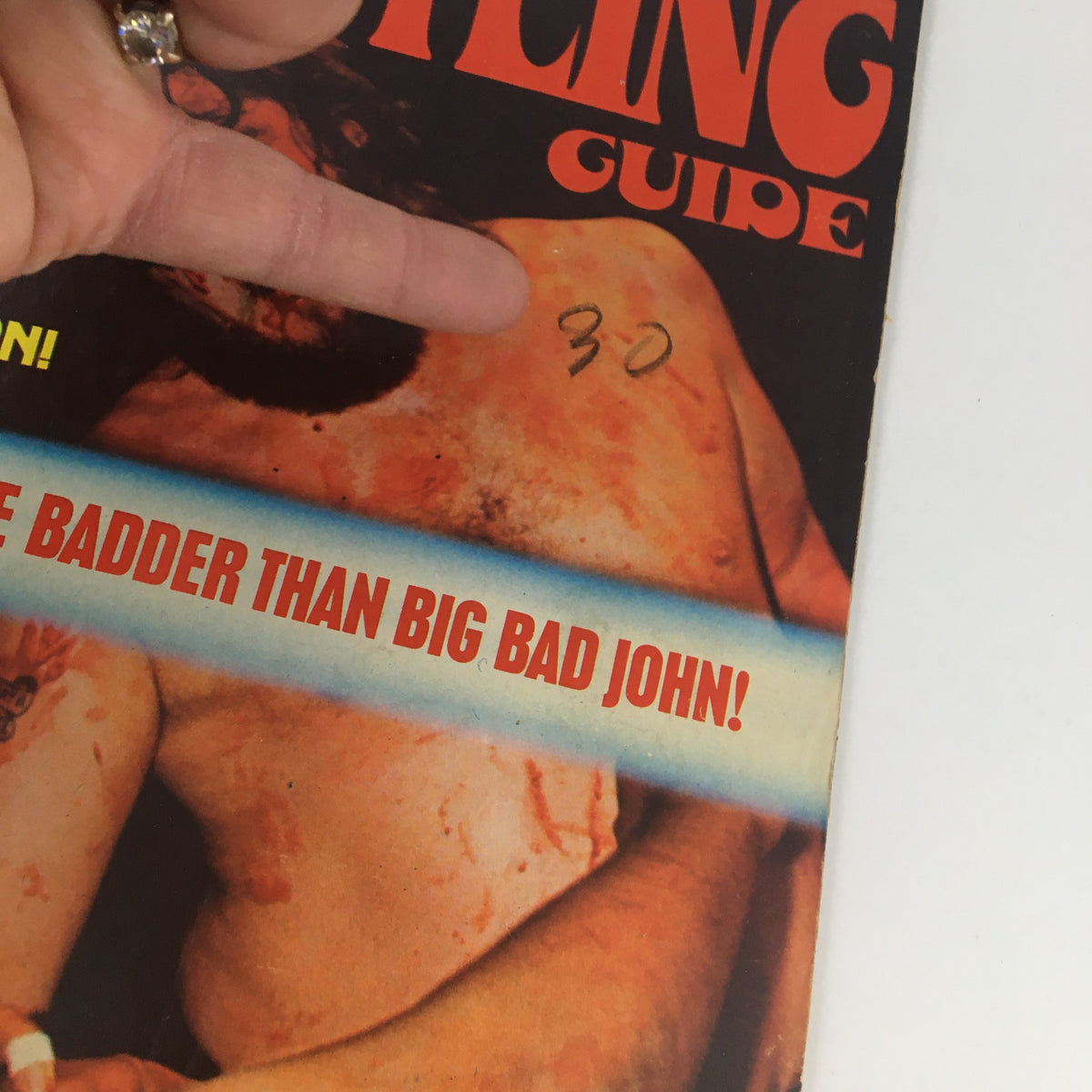 Another view of the Wrestling Guide October 1974 cover, highlighting the dramatic wrestling imagery and the tagline featuring Big Bad John.