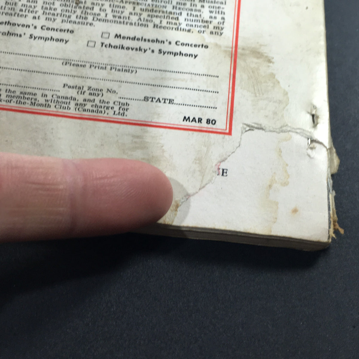 Close-up of the back cover of the VTG High Fidelity Music Magazine July 1956, highlighting wear and a noticeable rip, providing a glimpse into the magazine's vintage condition.