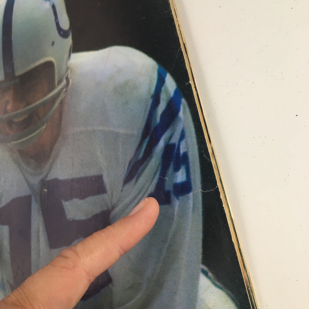 Close-up of the Sports Illustrated Magazine cover from November 25, 1968, highlighting details of Earl Morrall of the Baltimore Colts, including signs of age, such as rips and an address label.