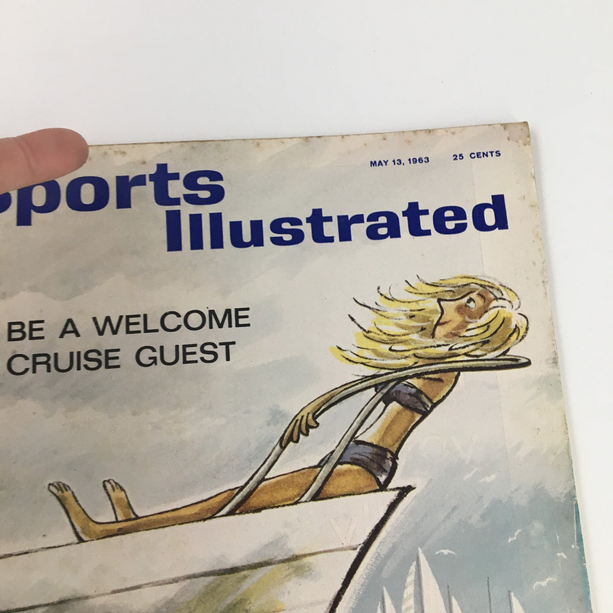 Close-up of the cover of Sports Illustrated Magazine from May 13, 1963 highlighting the title 'Be a Welcome Cruise Guest' with a vibrant illustration.