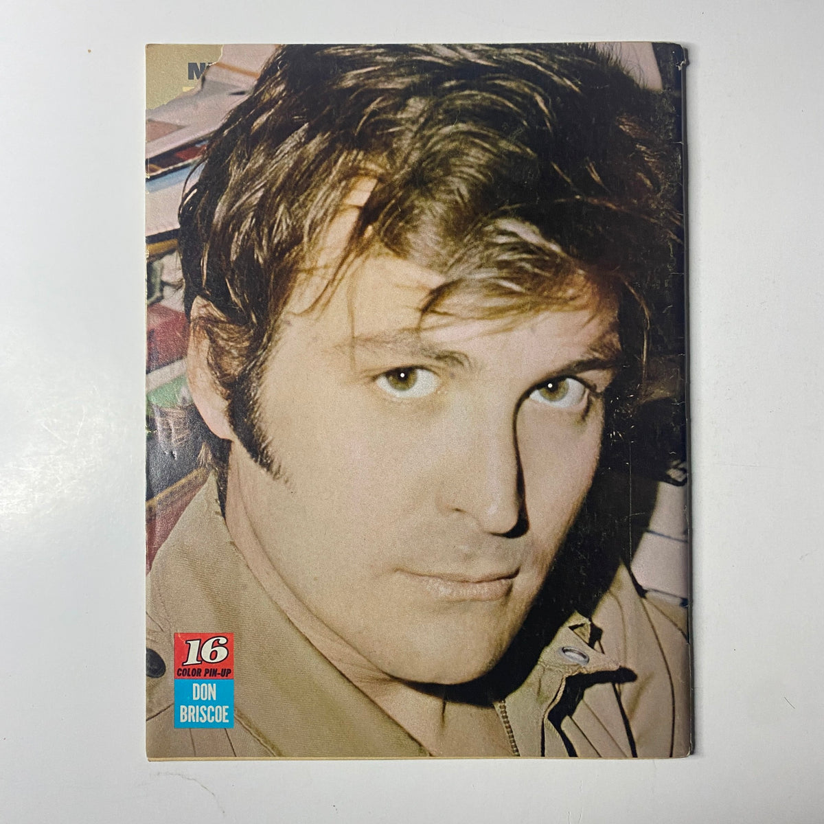Cover of 16 Magazine November 1969 featuring Mike Cole and Barry Cowsill, showcasing a portrait of Don Briscoe. This magazine includes exclusive pin-ups and a bonus poster.