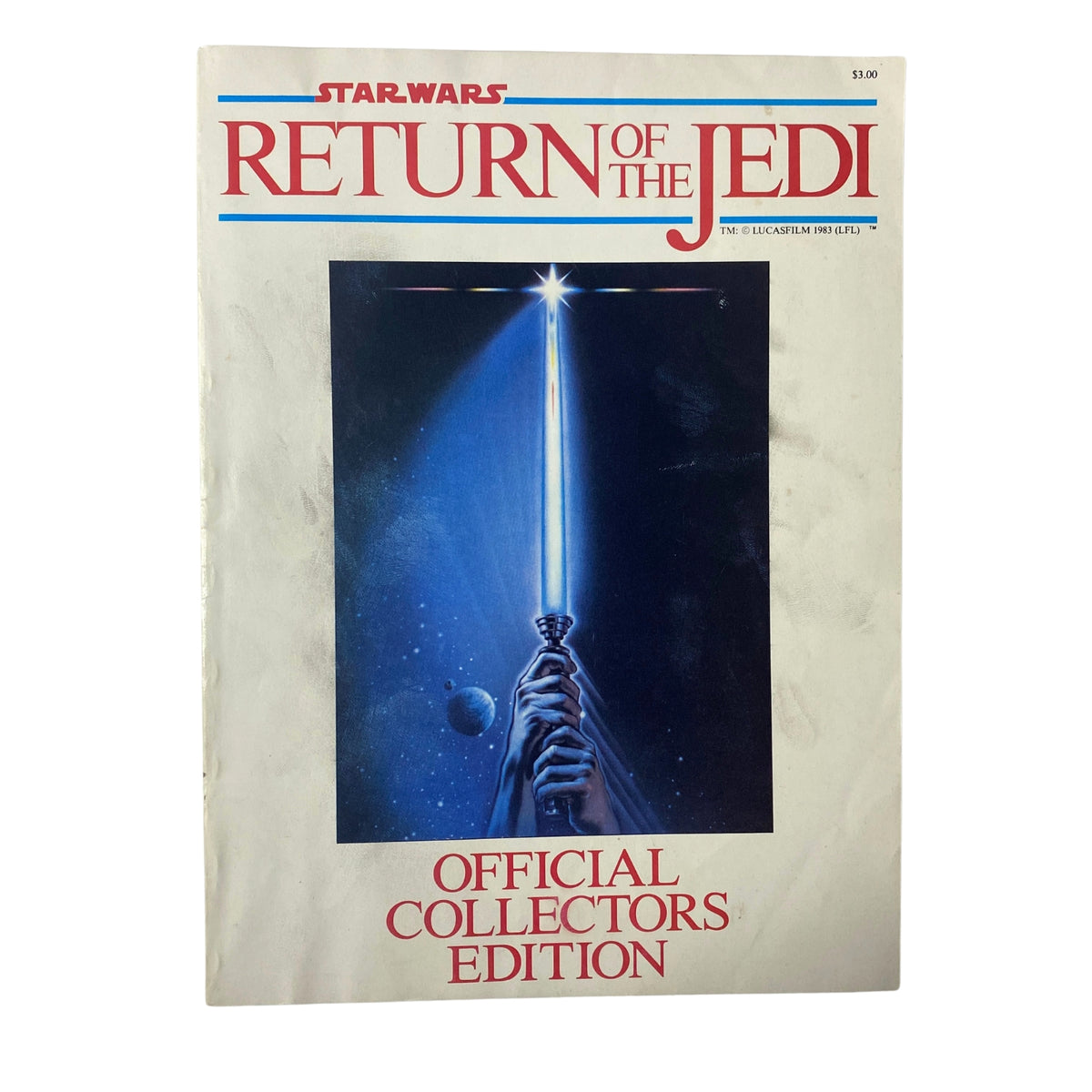 Cover of the 1983 Star Wars Return Of The Jedi, Official Collectors Edition magazine featuring a lightsaber against a cosmic backdrop.