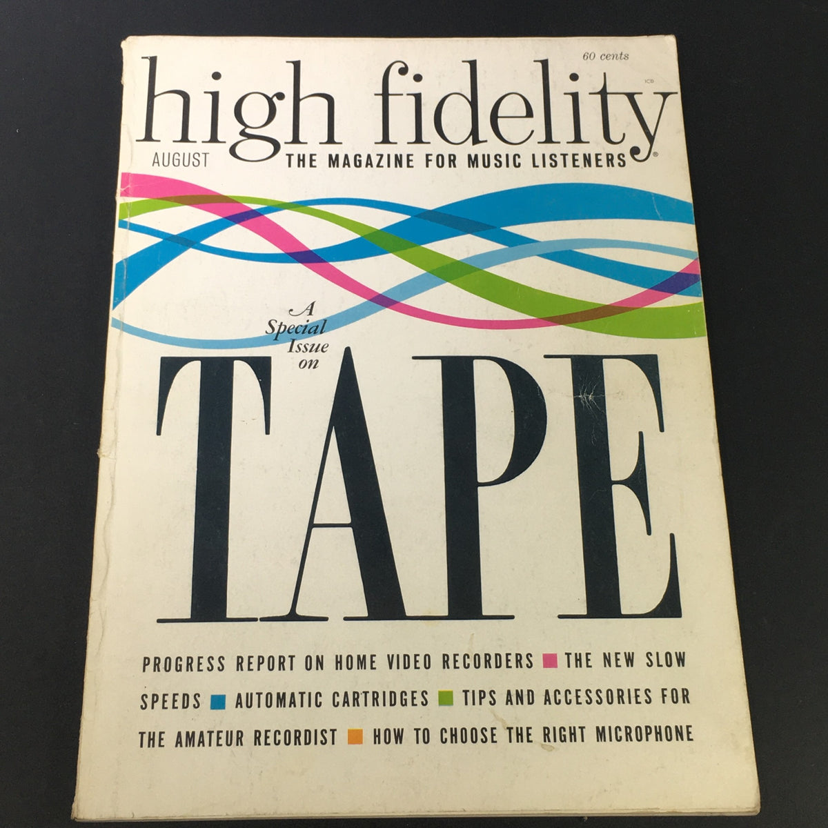 High Fidelity Music Magazine August 1964 cover featuring a special issue on tape, showcasing colorful graphic design elements and information about home video recorders and automatic cartridges.