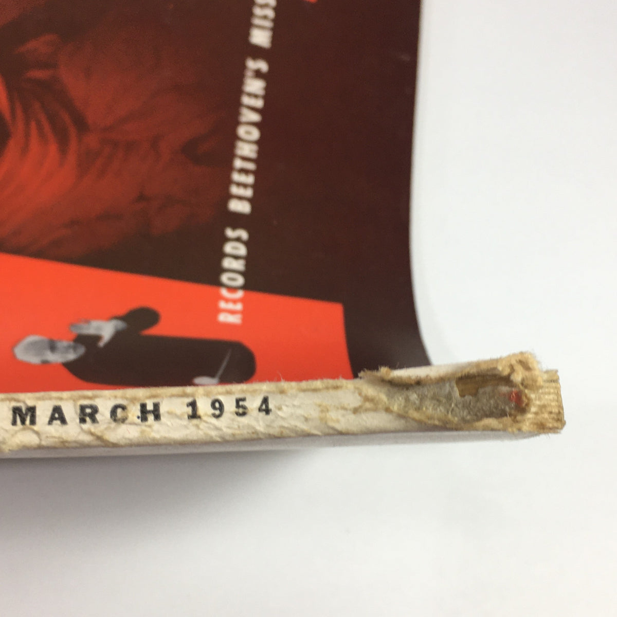 Spine of the High Fidelity Music Magazine March 1954, displaying the publication date and signs of wear consistent with its vintage nature.