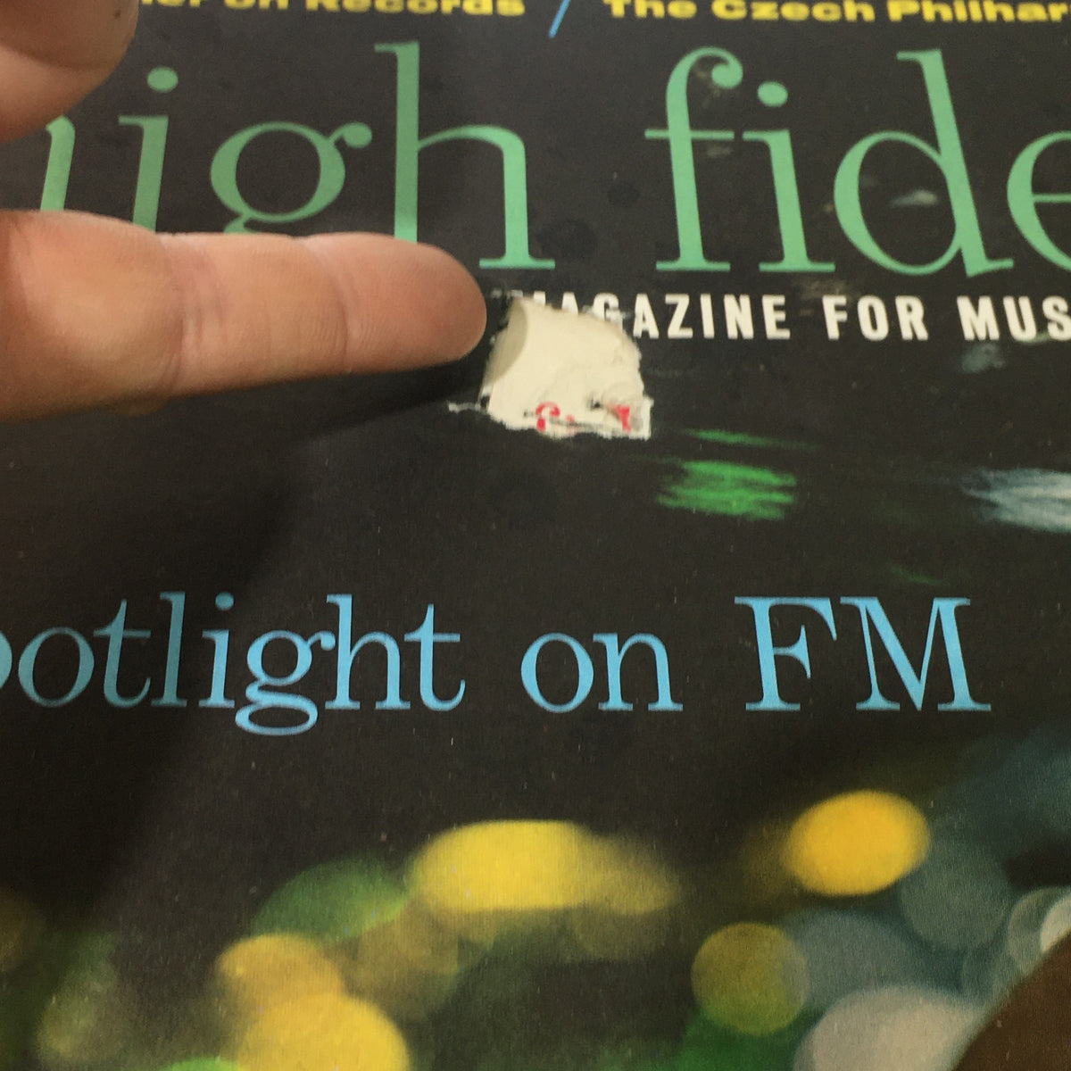 Close-up of the cover of VTG High Fidelity Music Magazine May 1962 showing a tear and label on the cover, highlighting its vintage condition.