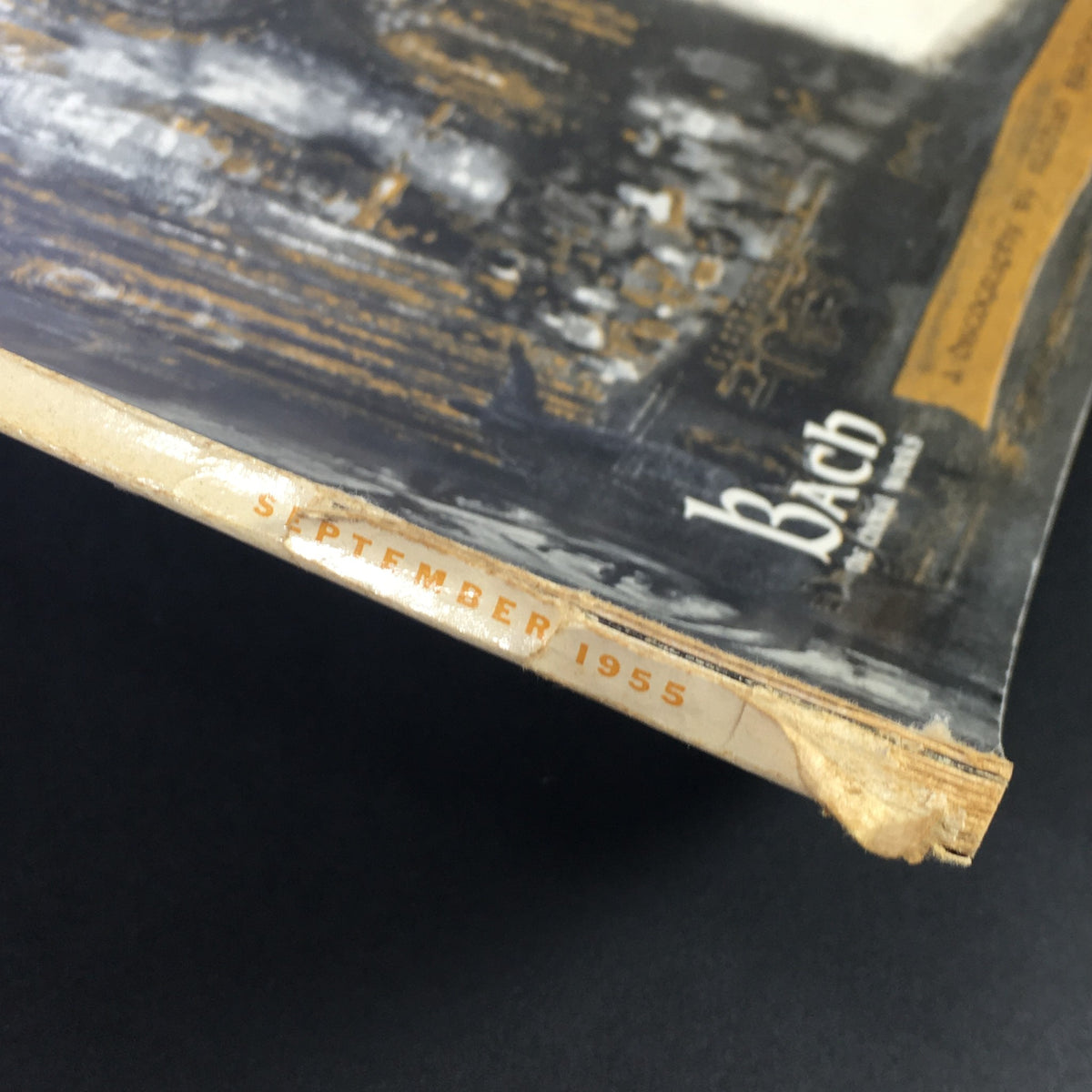 Side view of the VTG High Fidelity Music Magazine, September 1955, showcasing the spine with the month and year embossed in orange, highlighting its vintage appeal.