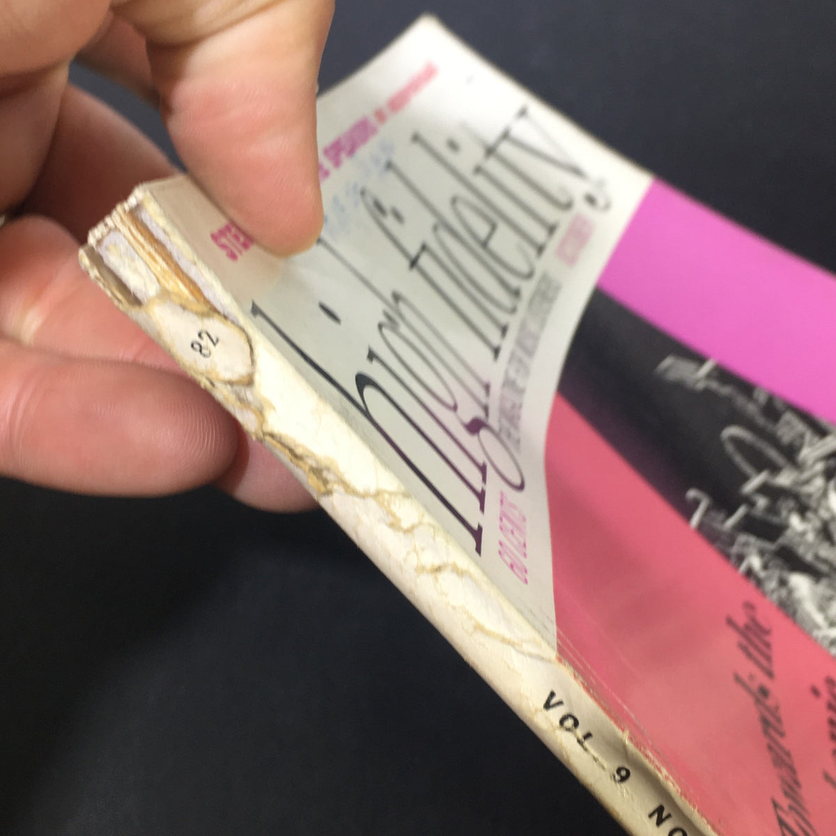 Close-up view of the worn edge of the VTG High Fidelity Music Magazine October 1959, showcasing signs of age with frayed pages.