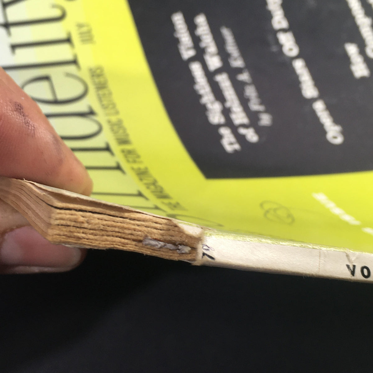 Side view of the VTG High Fidelity Music Magazine July 1959 displaying the spine and slight wear, emphasizing its vintage condition.