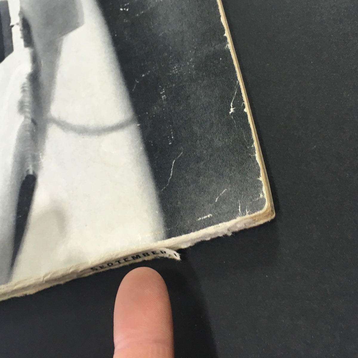 Detail of the bottom edge of the VTG High Fidelity Music Magazine September 1960, showing the publication date and minor wear that adds to its vintage character.