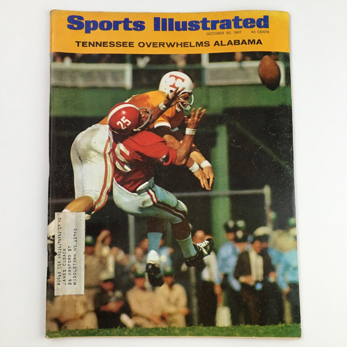 Cover of Sports Illustrated Magazine dated October 30, 1967 featuring the title 'Tennessee Overwhelms Alabama'. The cover captures an iconic college football moment with a player in Tennessee gear throwing a pass while being tackled by an Alabama defender. This vintage magazine is a collectible piece from a historic football season.