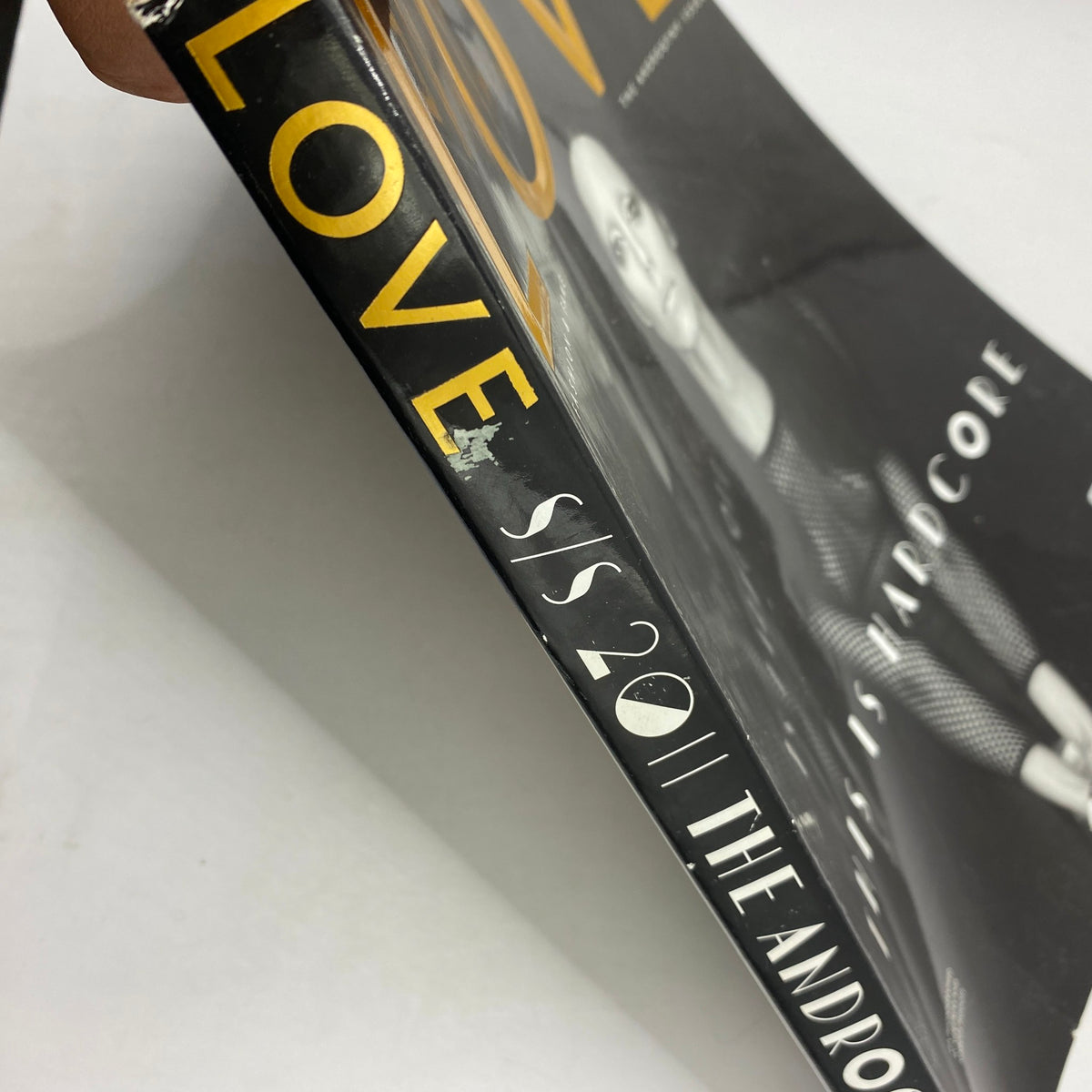Side view of the Love Magazine 2011 emphasizing its spine and detailing, part of the Justin Bieber 'The Beautiful One' edition, perfect for magazine enthusiasts.