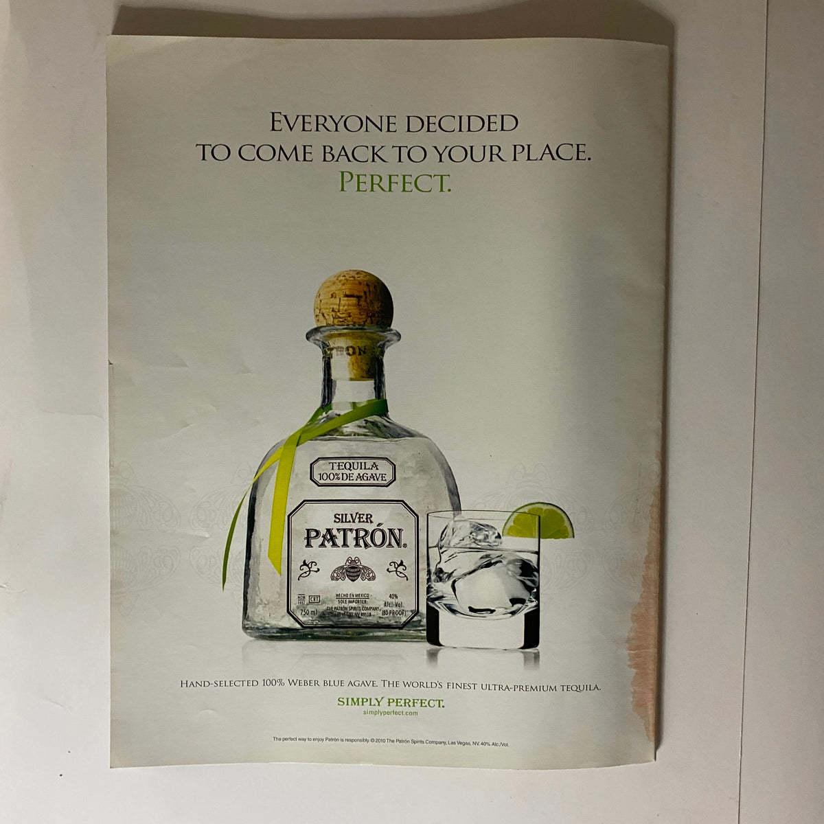 Back advertisement from Interview Magazine May 2010 featuring Patron tequila, promoting a social lifestyle with a bottle and glass presentation.