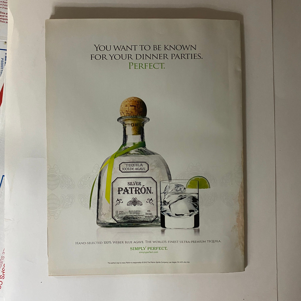 Tequila advertisement page from Interview Magazine August 2010, promoting Patron Silver tequila with a polished bottle and glass.