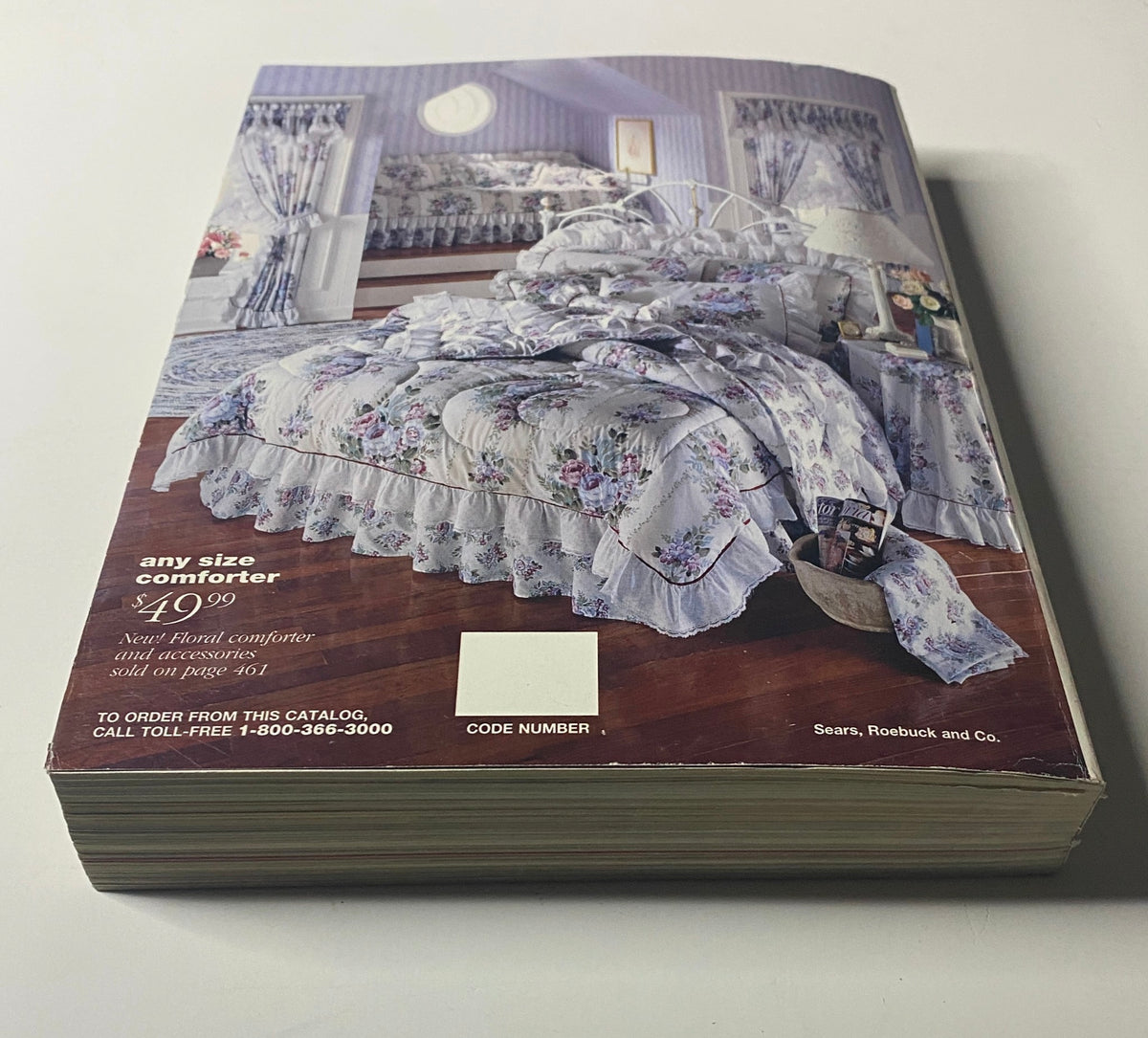 Image from the 1993 Sears Spring Summer Annual Catalog showing the back cover of a floral comforter set, depicting household textiles and pricing information.