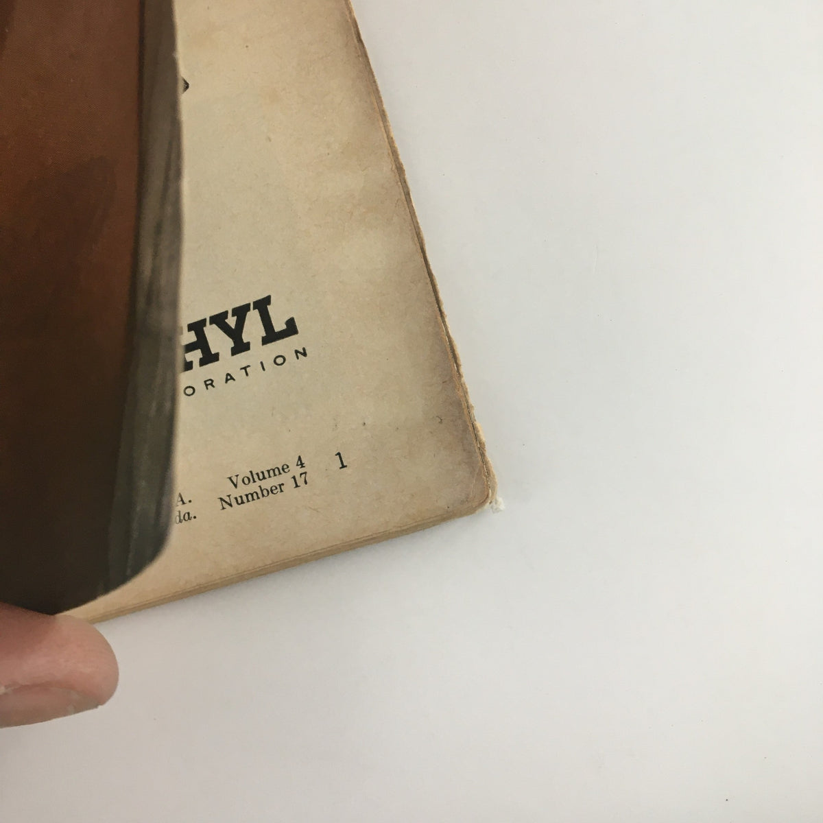 Side view of the spine of Sports Illustrated Magazine April 23 1956, illustrating the age and character of this vintage collectible.
