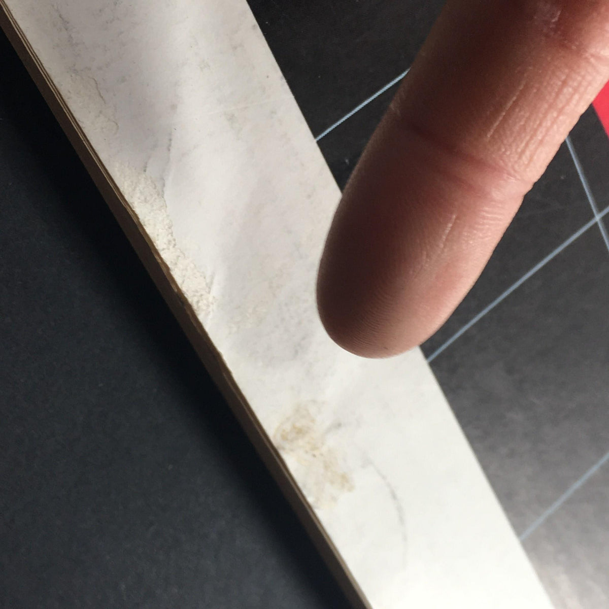 Detailed view of the spine of the VTG Business Management Magazine April 1965, illustrating signs of wear with finger pointing to marks, adding to its vintage character.