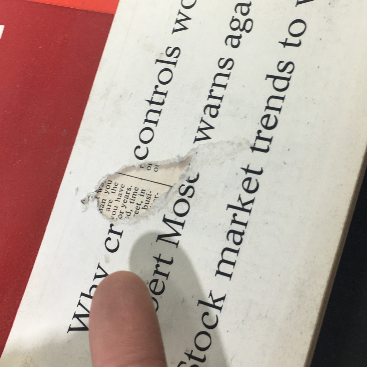Close-up of the VTG Nation's Business Magazine December 1964 cover showing a torn section with text regarding economic controls and market trends.