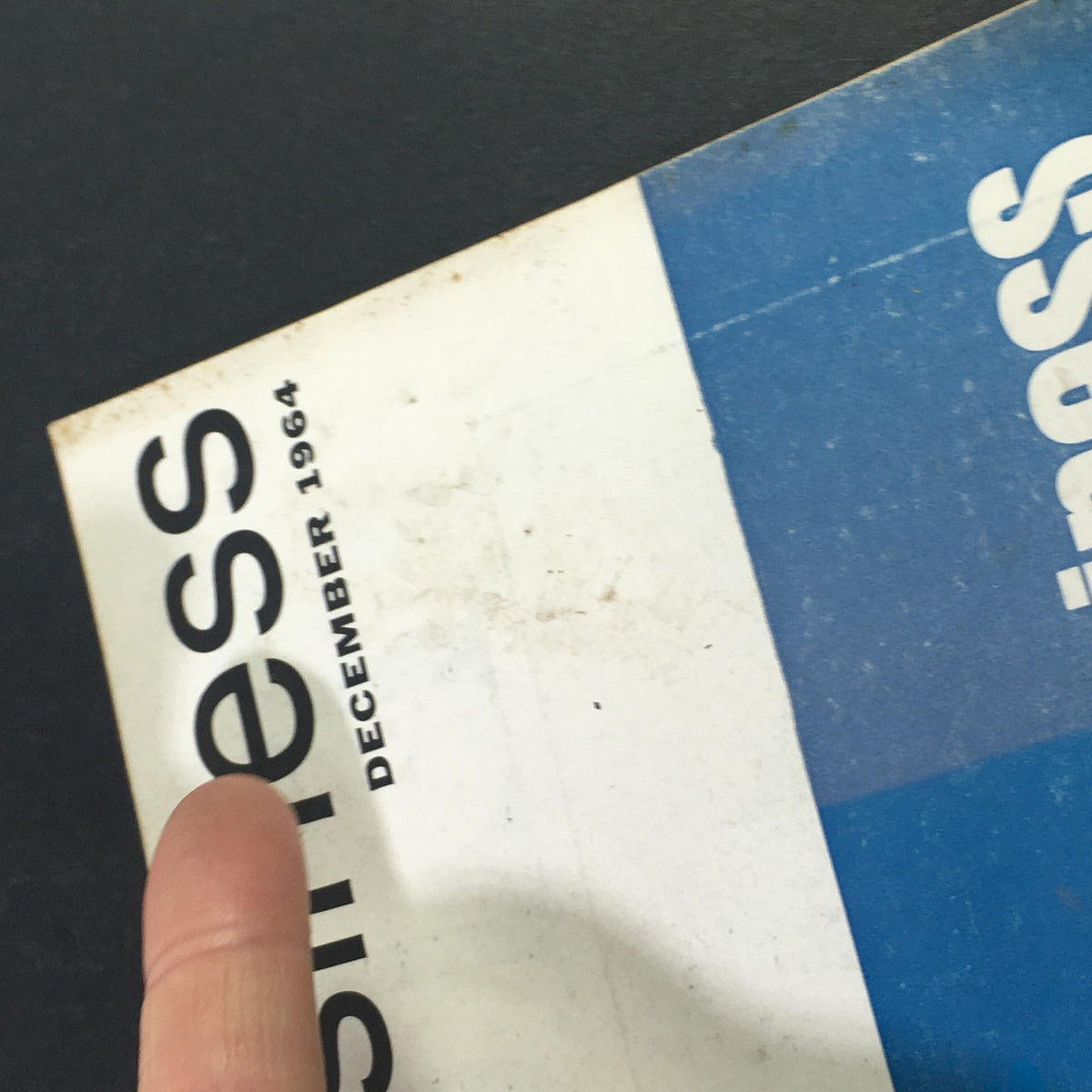 Side view of the VTG Nation's Business Magazine December 1964, indicating the publication date and showing signs of wear.