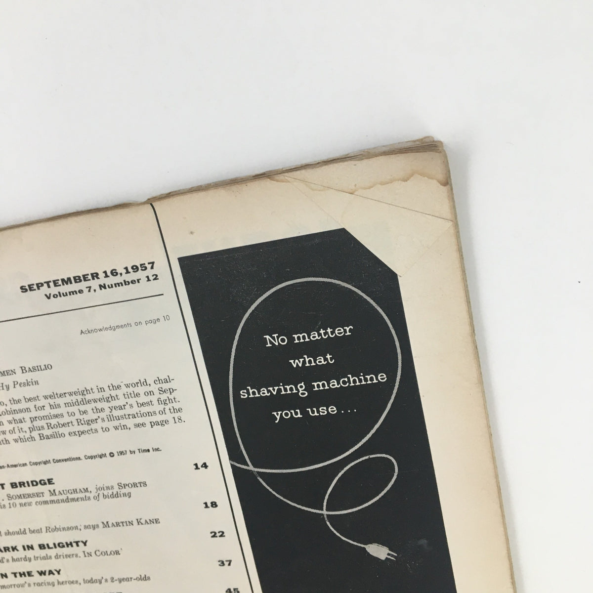 Close-up of the interior page from Sports Illustrated Magazine September 16, 1957, showcasing the title with Carmen Basilio, and the Old Spice shaving advertisement.