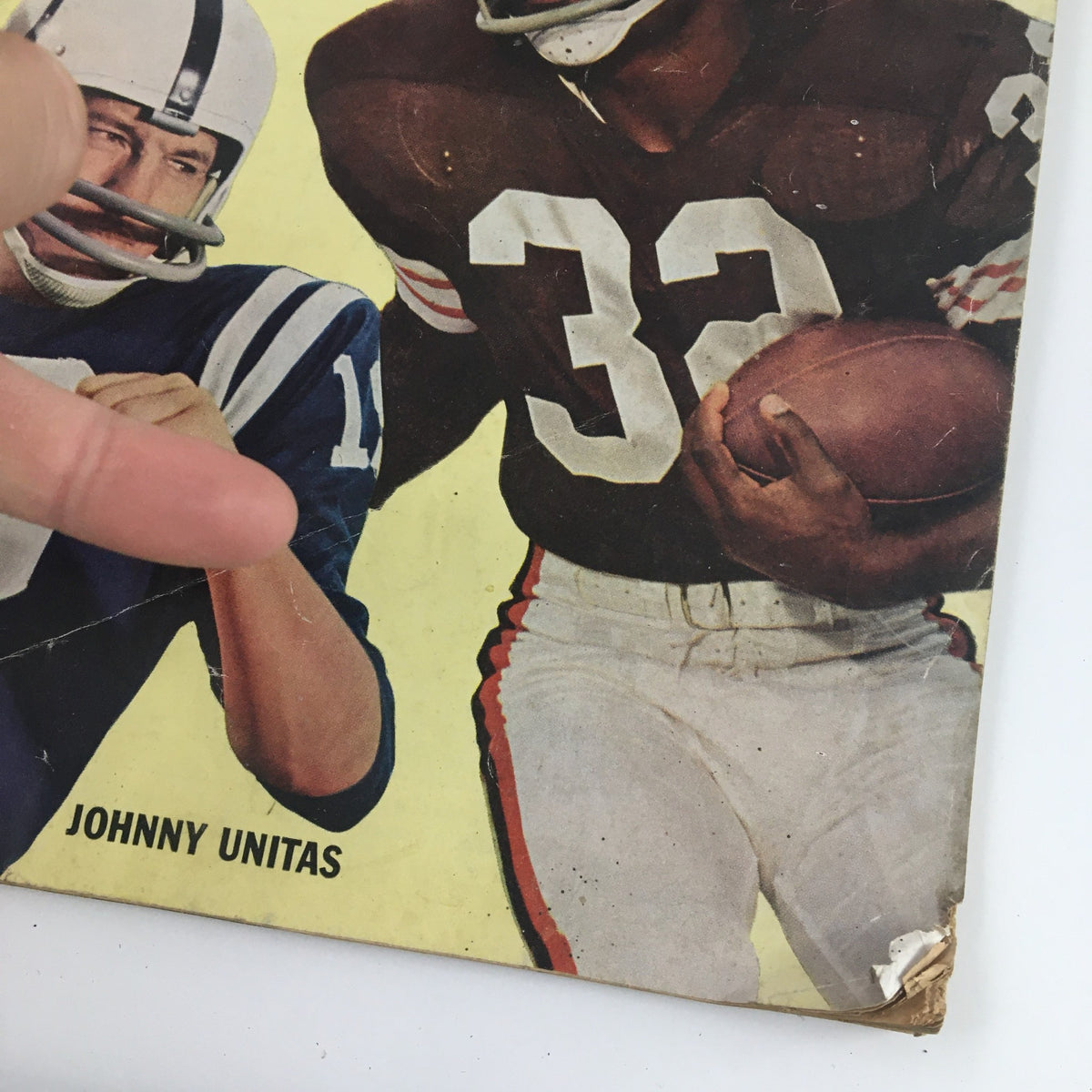 Close-up of Sports Magazine December 1962 cover highlighting NFL players Johnny Unitas and Jimmy Brown, featuring minor creases.