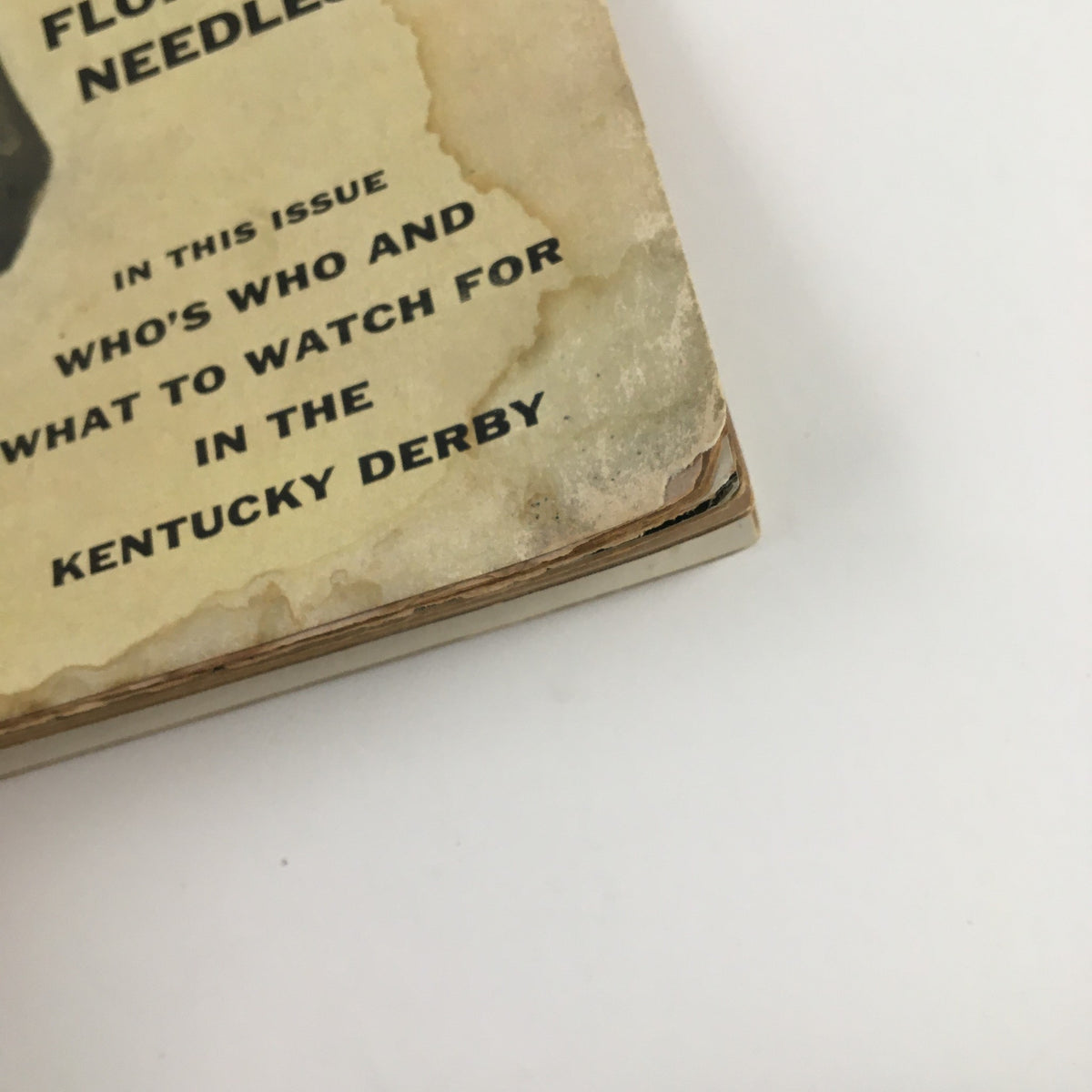 Close-up of the spine of Sports Illustrated Magazine May 7 1956, highlighting details about featured content including thoroughbred racehorse Needles and insights into the Kentucky Derby.