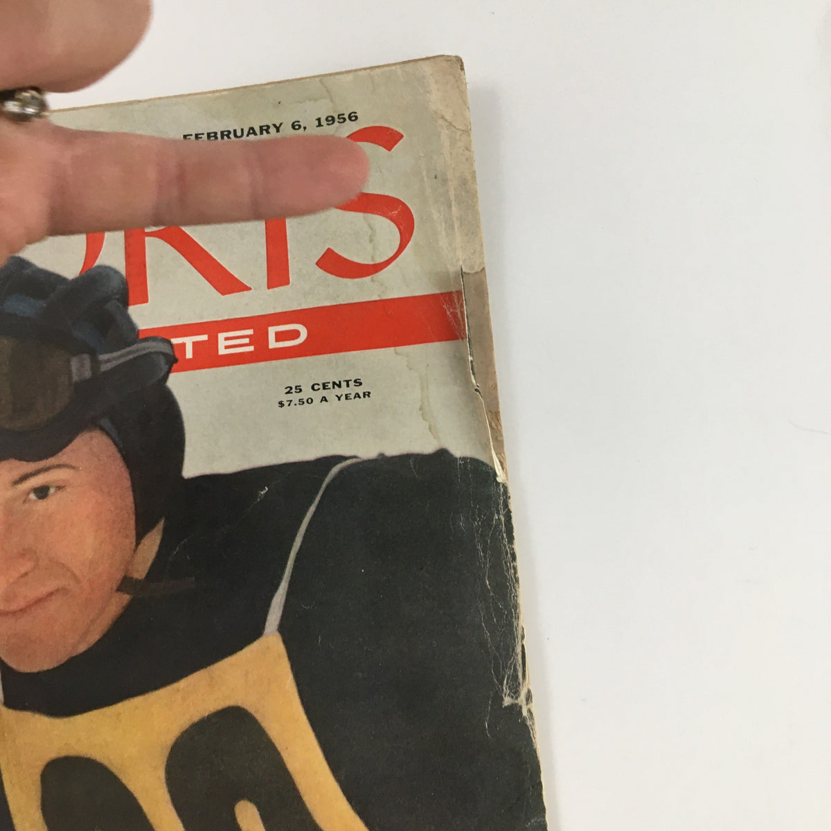 Close-up of Sports Illustrated Magazine February 6, 1956, highlighting Ralph Miller and the magazine's vintage appeal.
