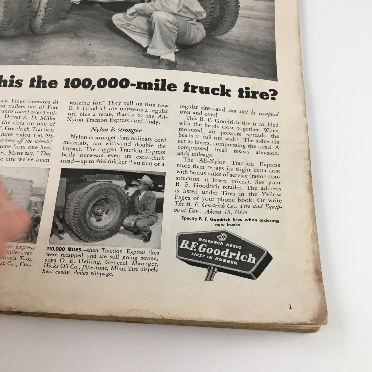 Inside page of Sports Illustrated Magazine October 4 1954 featuring advertisement for B.F. Goodrich tires, showcasing a man inspecting a truck tire with text about its durability.