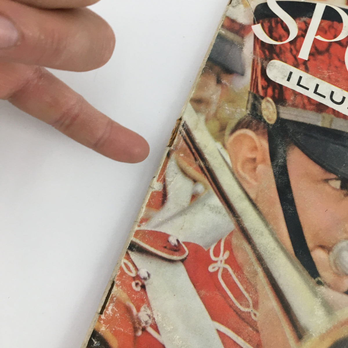 Close-up detail of the Sports Illustrated Magazine October 11 1954 cover, highlighting the Oklahoma Band member playing a trombone.