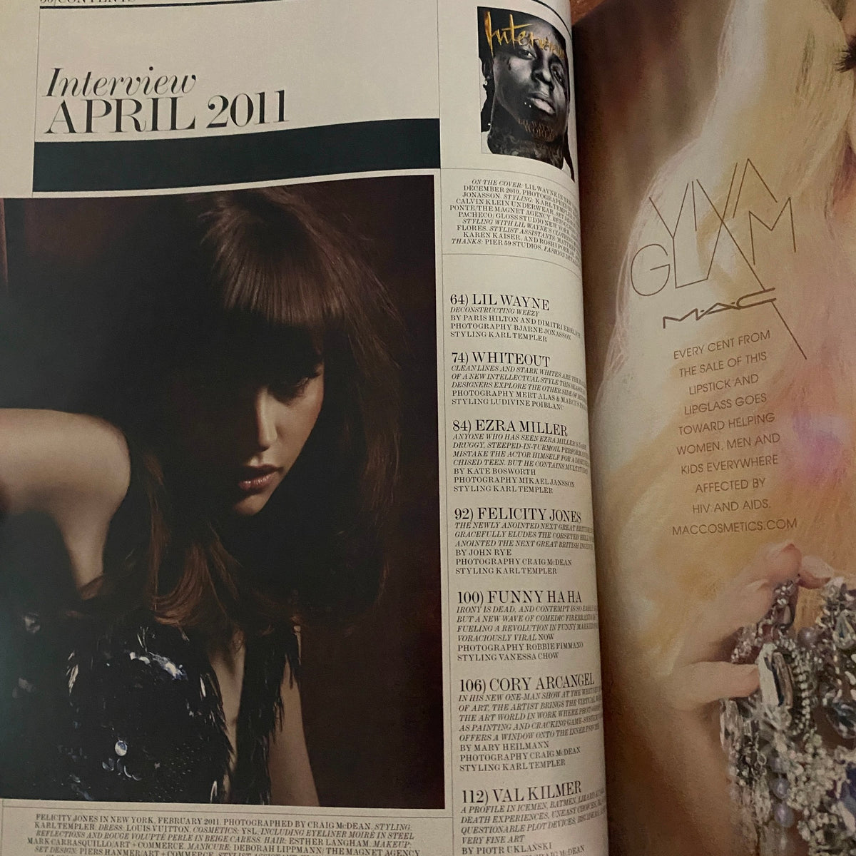 Interview Magazine April 2011 featuring Lil Wayne, showcasing a stylistic portrait of a model with a dramatic hairstyle, representing pop culture and celebrity culture through the lens of Paris Hilton.