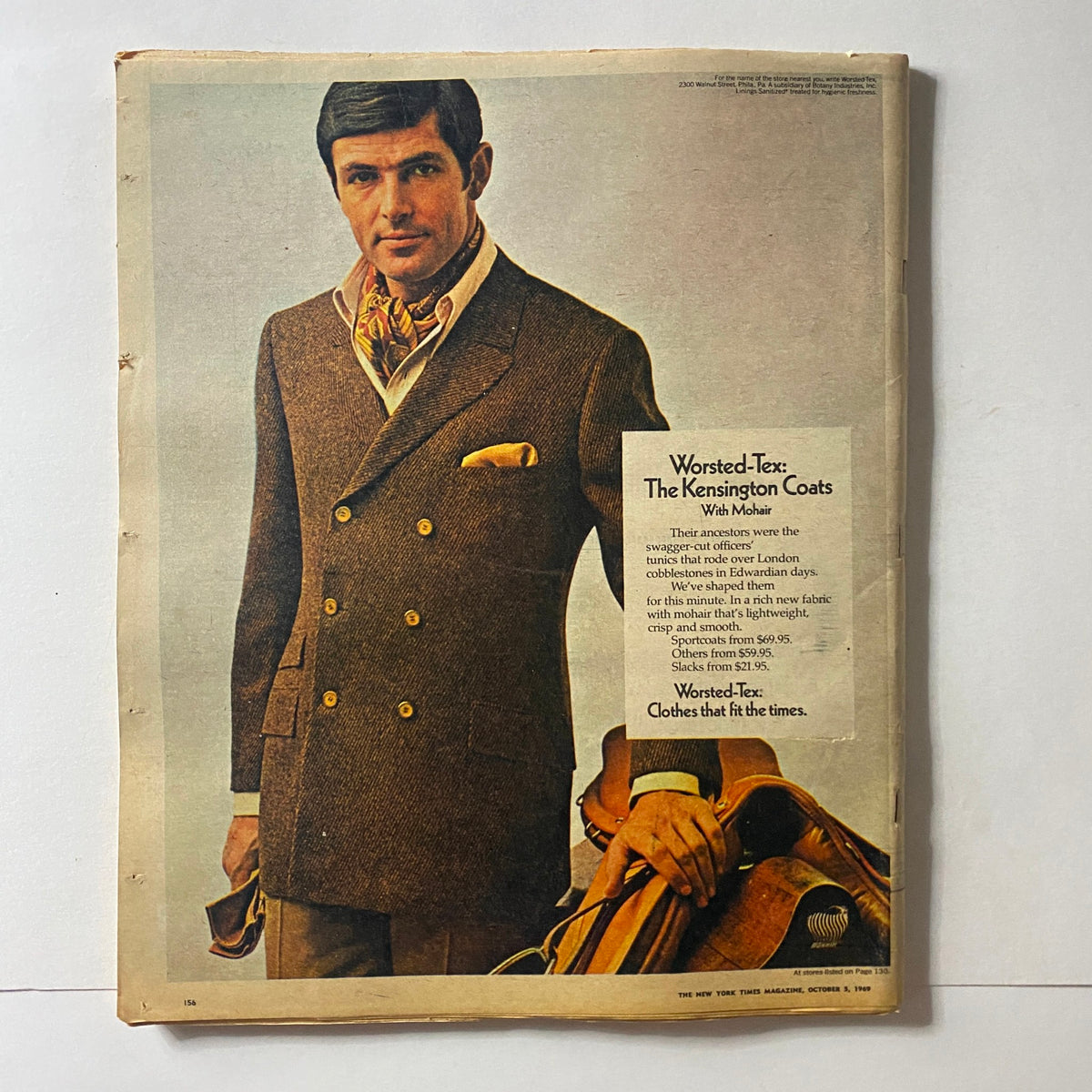 Back cover of The New York Times Magazine, October 5, 1969, showcasing a stylish man in a worsted coat with a scarf and a classic pose, promoting Kensington Coats.