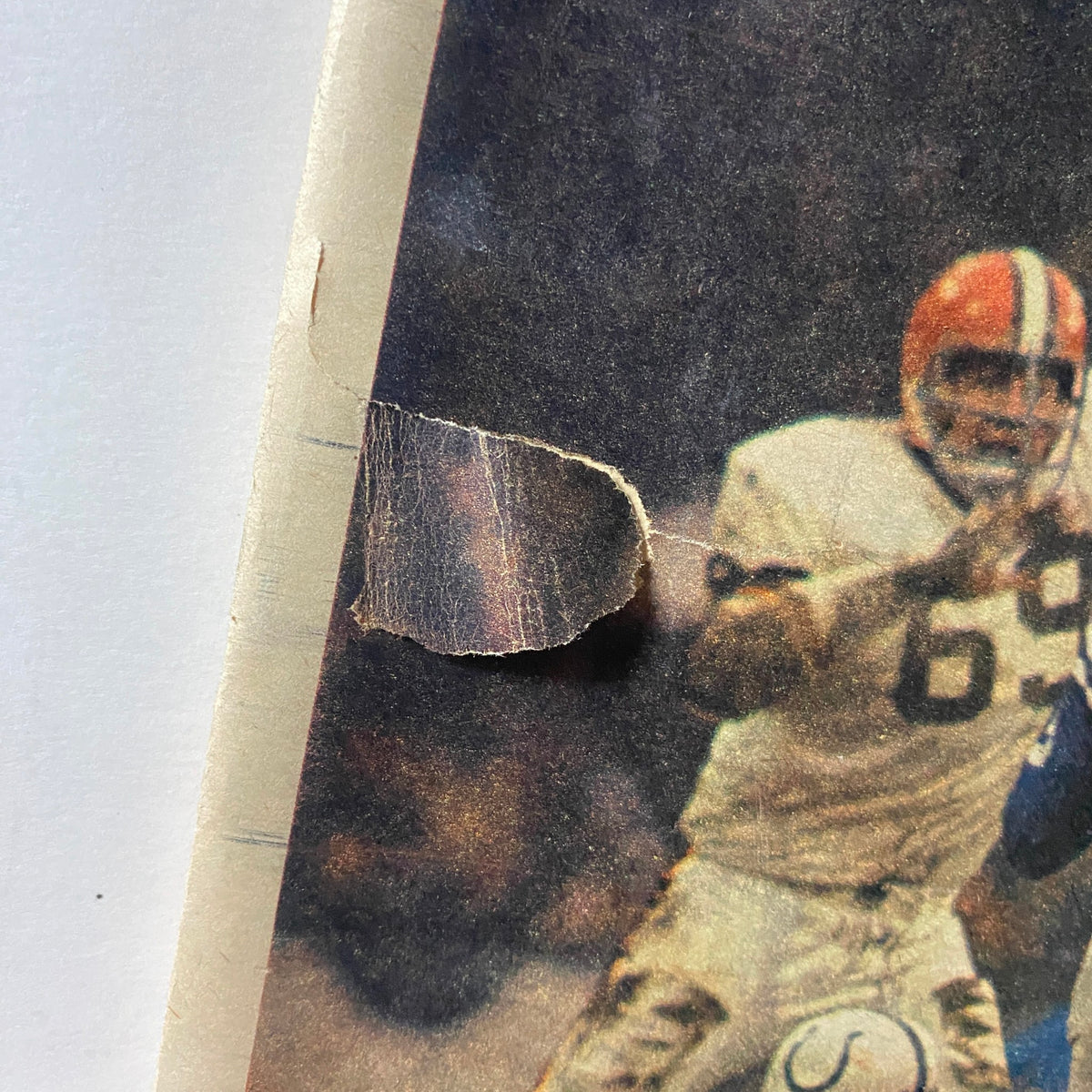 Close-up detail of the cover damage on The New York Times Magazine, October 26, 1969, showcasing wear on 'Pro Football's Broken Men'.